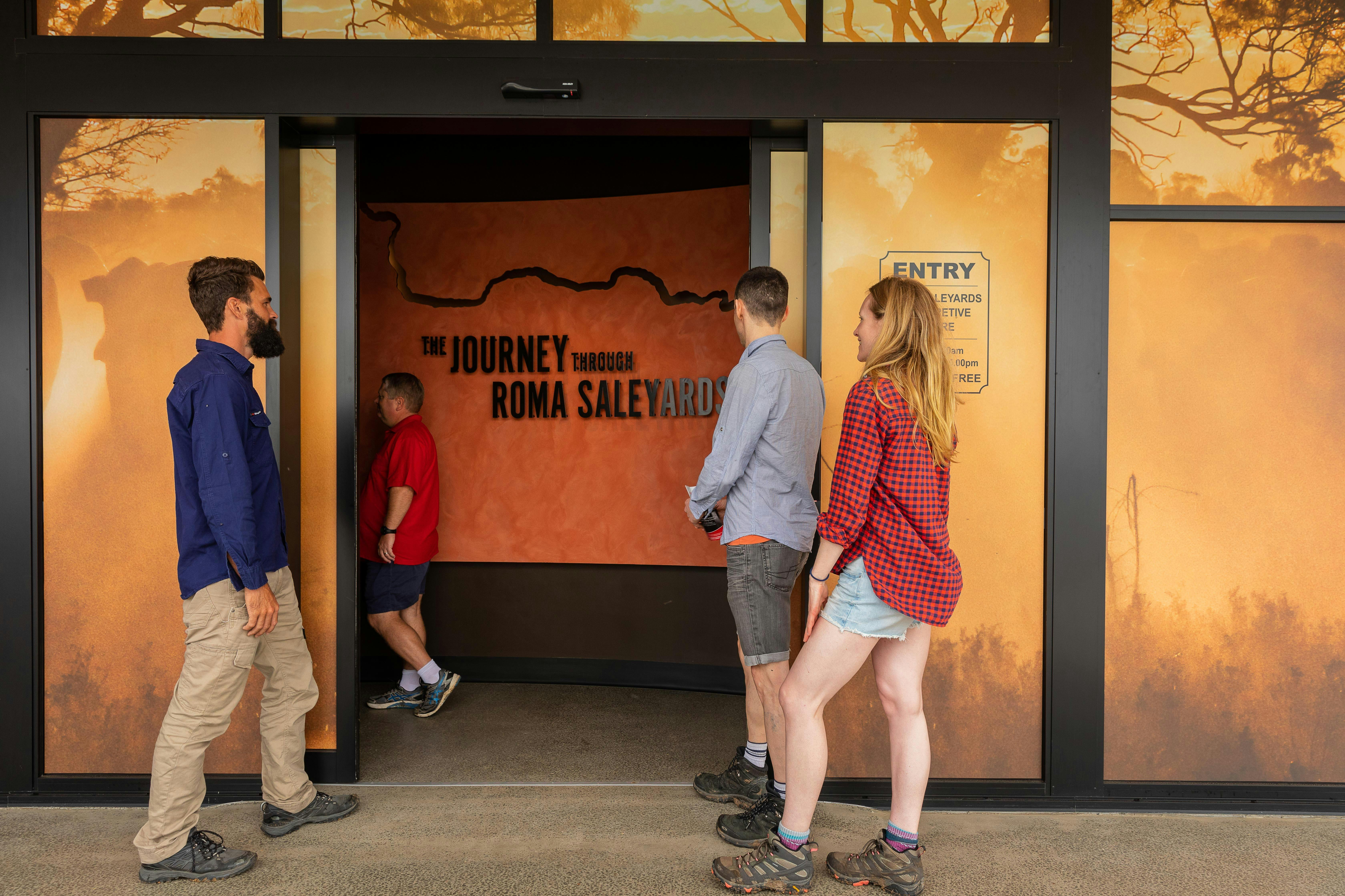 A group of four people entering the Val Harms Interactive Centre