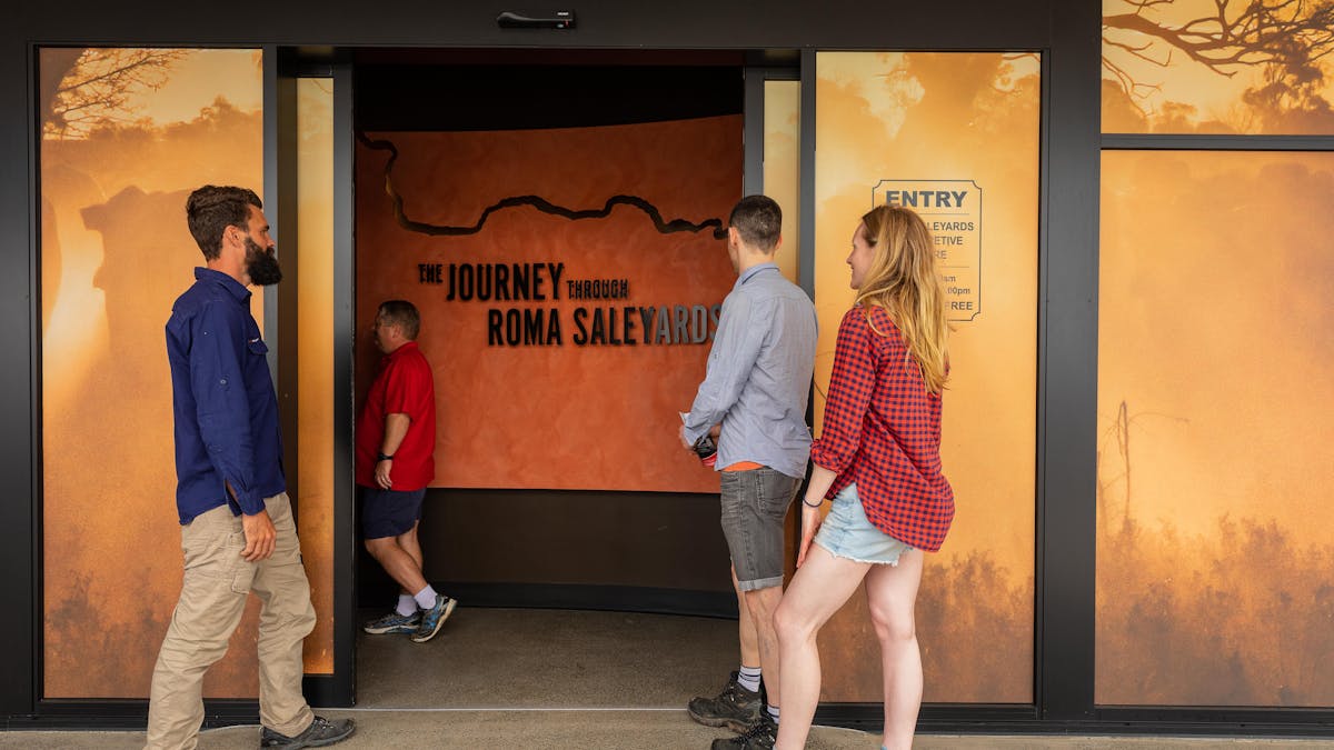 A group of four people entering the Val Harms Interactive Centre