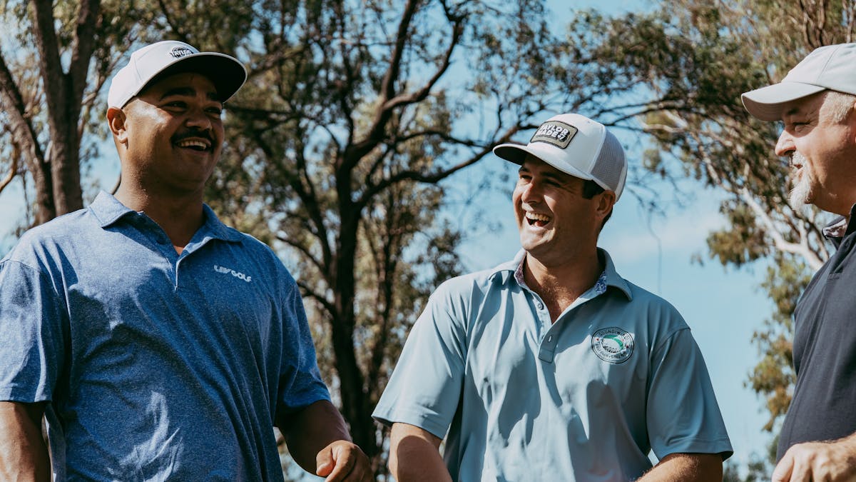 Three Male Golfers enjoying a hit