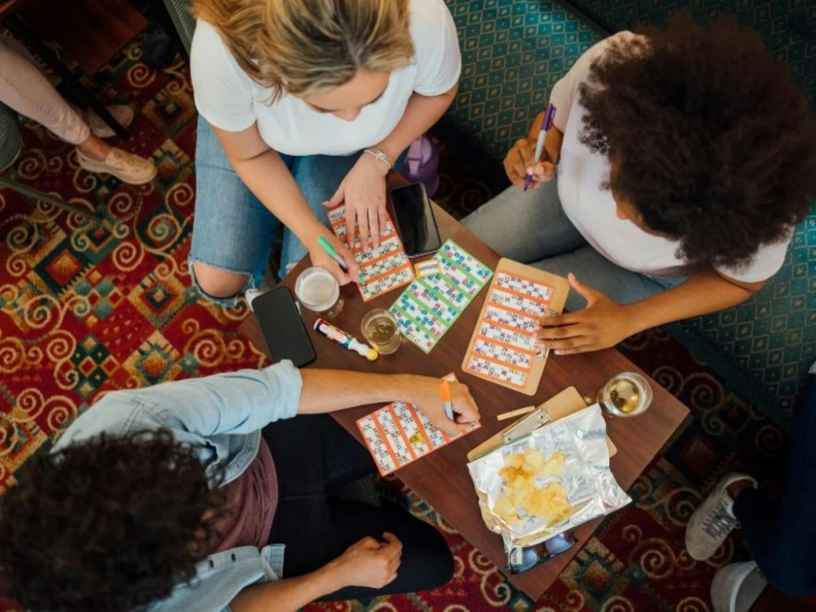 Image of three people playing bingo at the pub