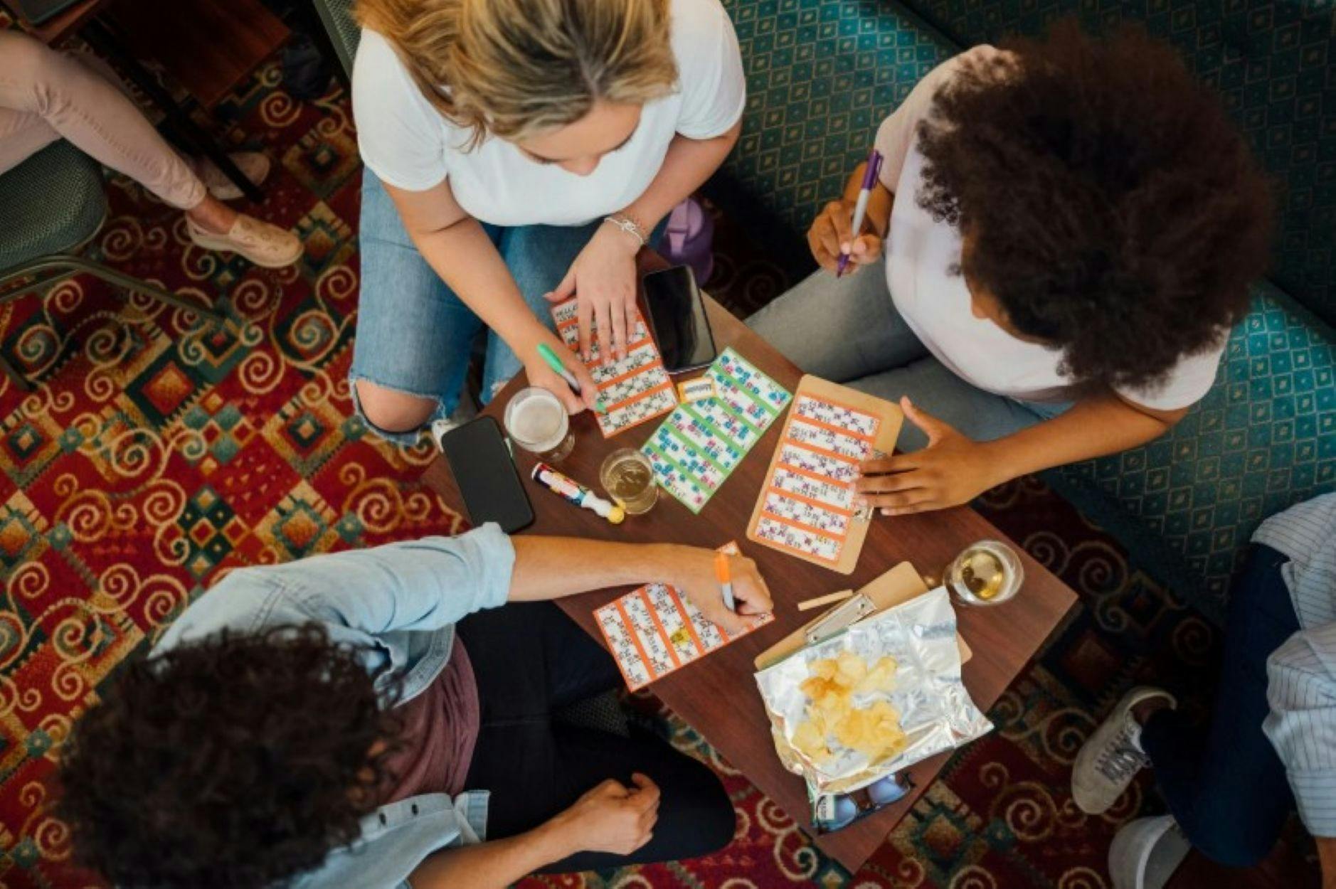 Image of three people playing bingo at the pub