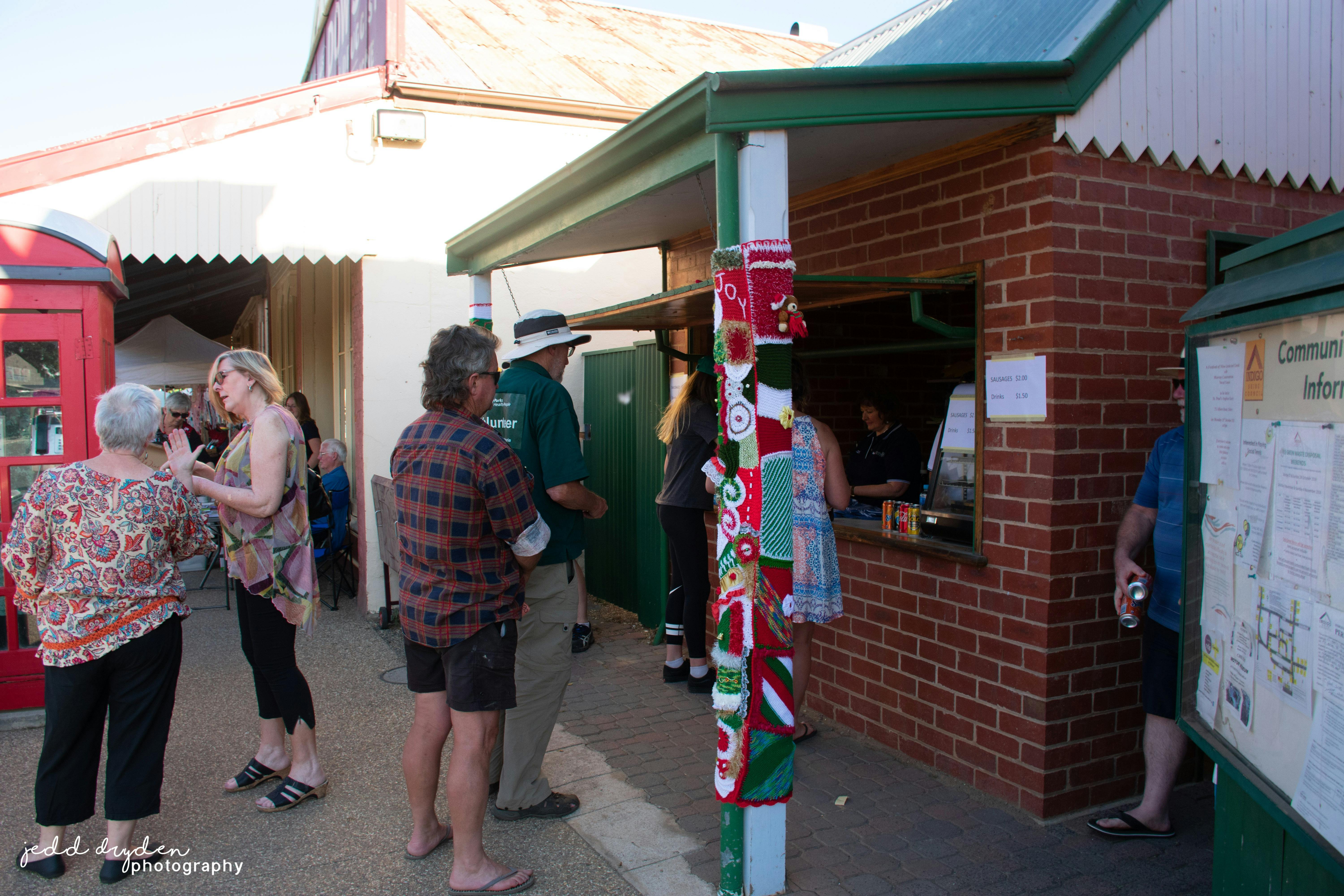 LIons Booth with customers waiting for sausages