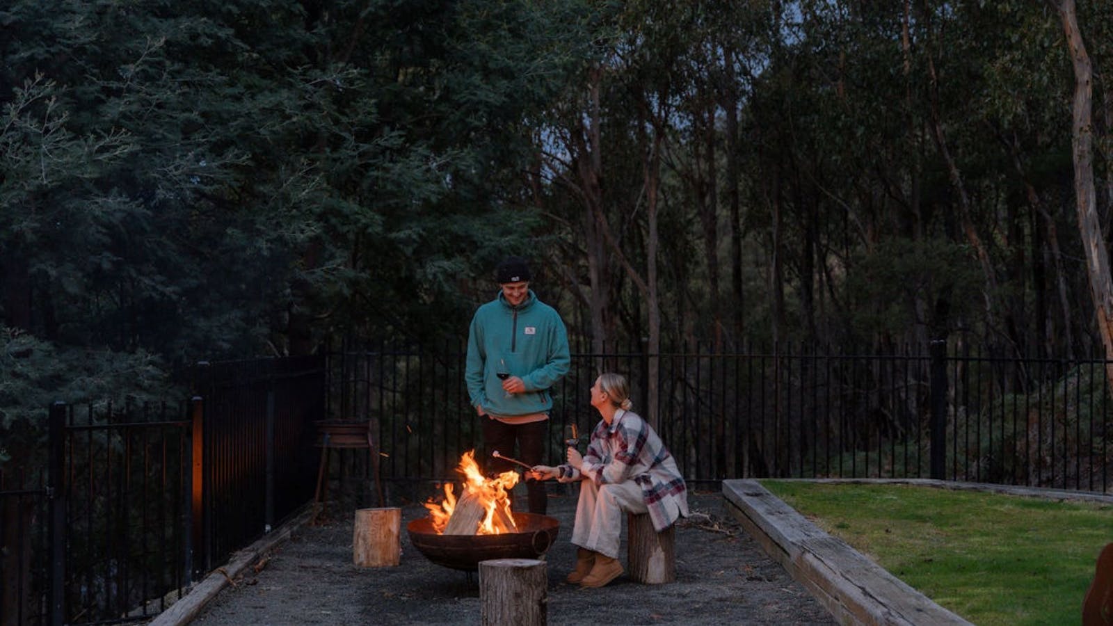Toasting marshmallows over the fire underneath the stars