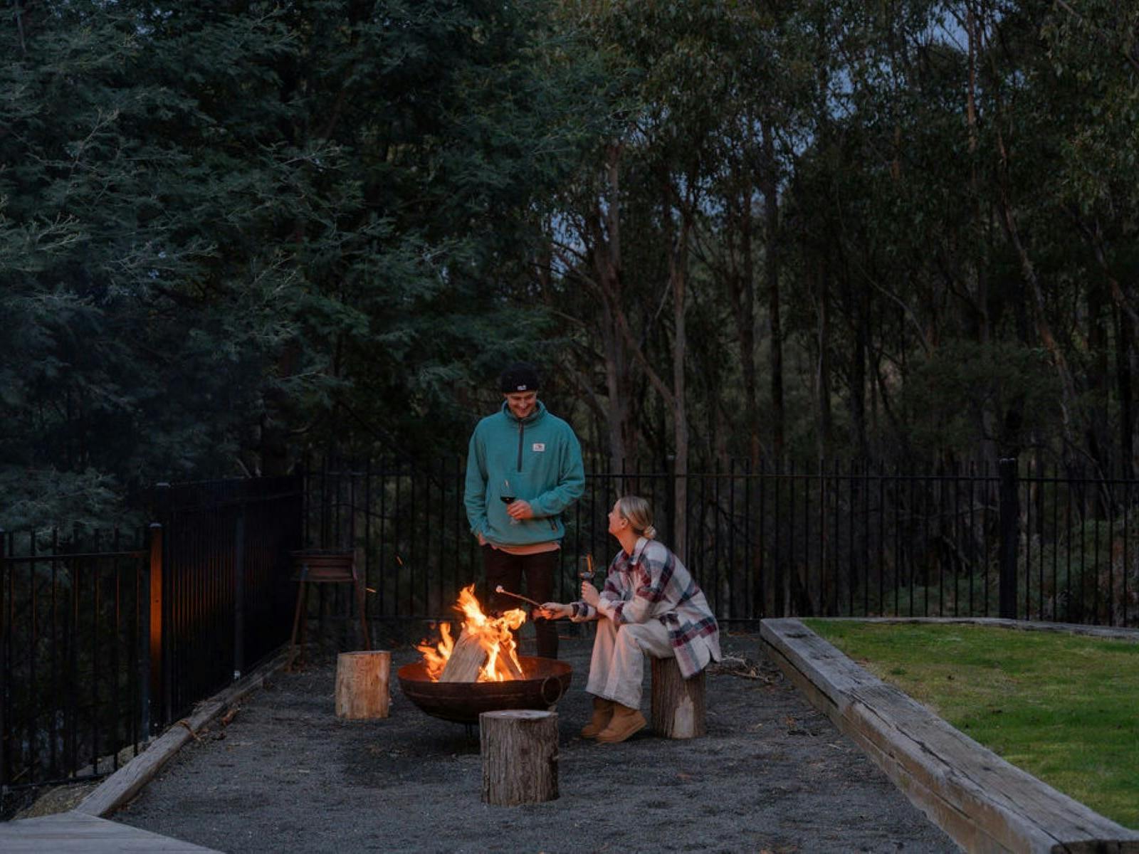 Toasting marshmallows over the fire underneath the stars