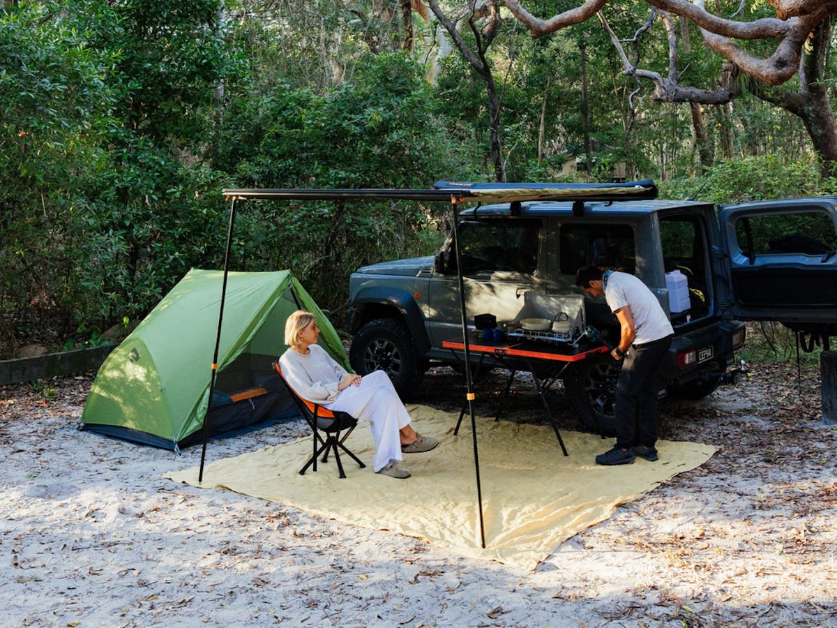 Private campsite surrounded by nature while campers relax