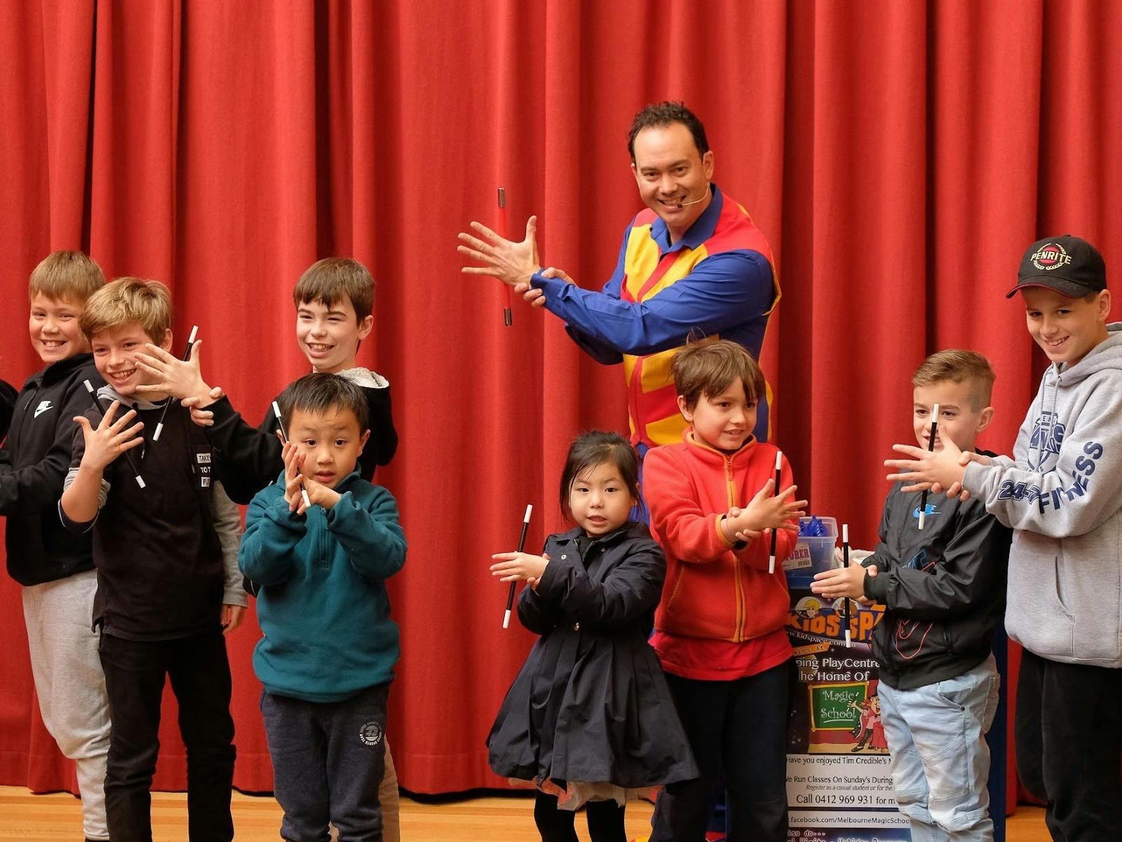 Kids learning magic tricks at Magic School with Tim Credible during the Melbourne school holidays