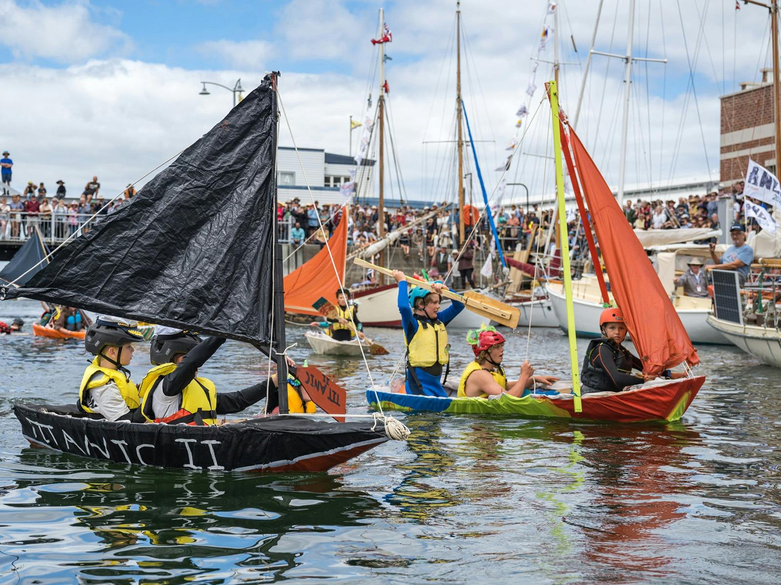 Children take part in a rally in boats they built themselves at Constitution Dock
