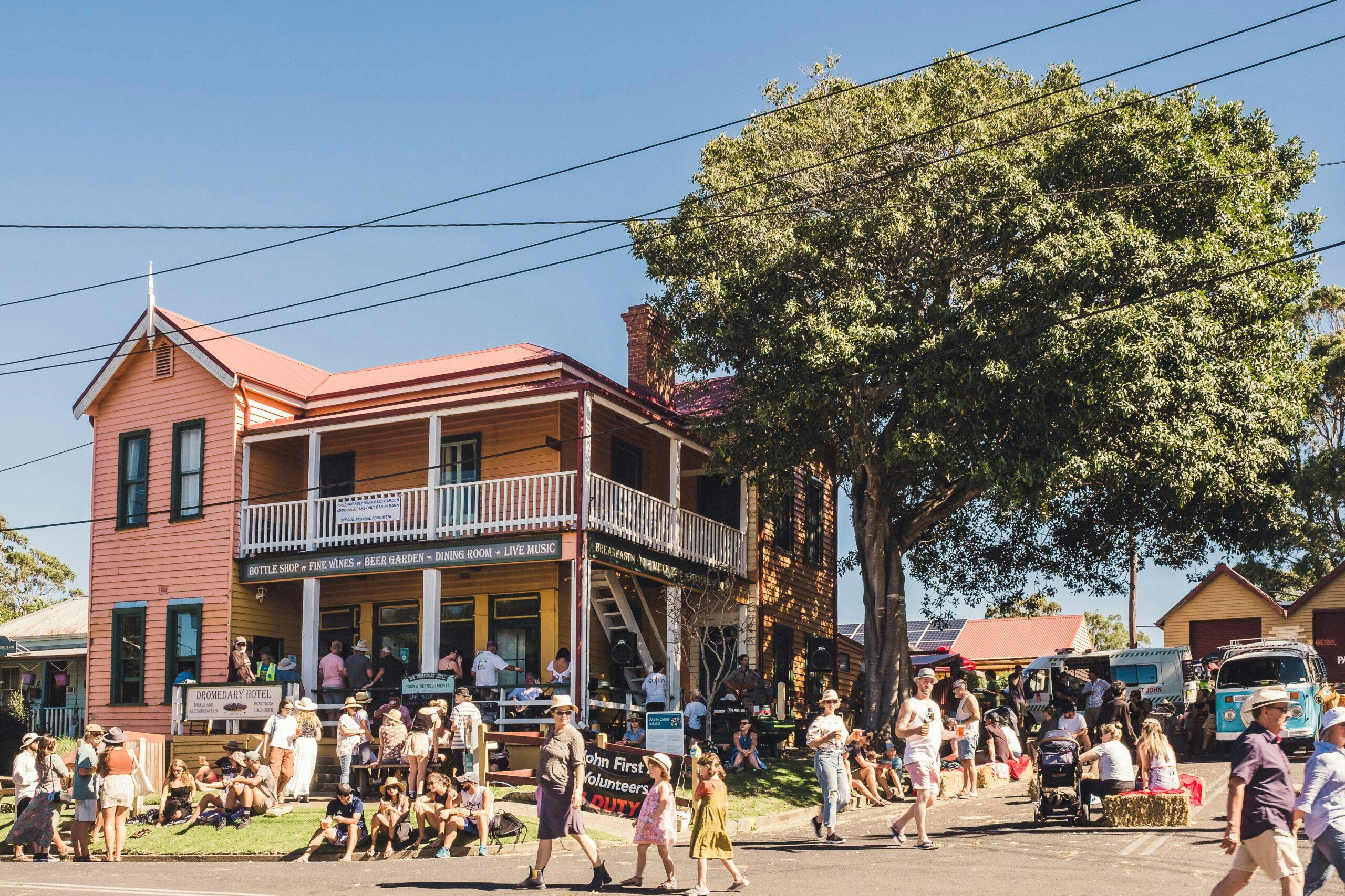 The Dromedary Hotel street frontage with festival goers in forefront