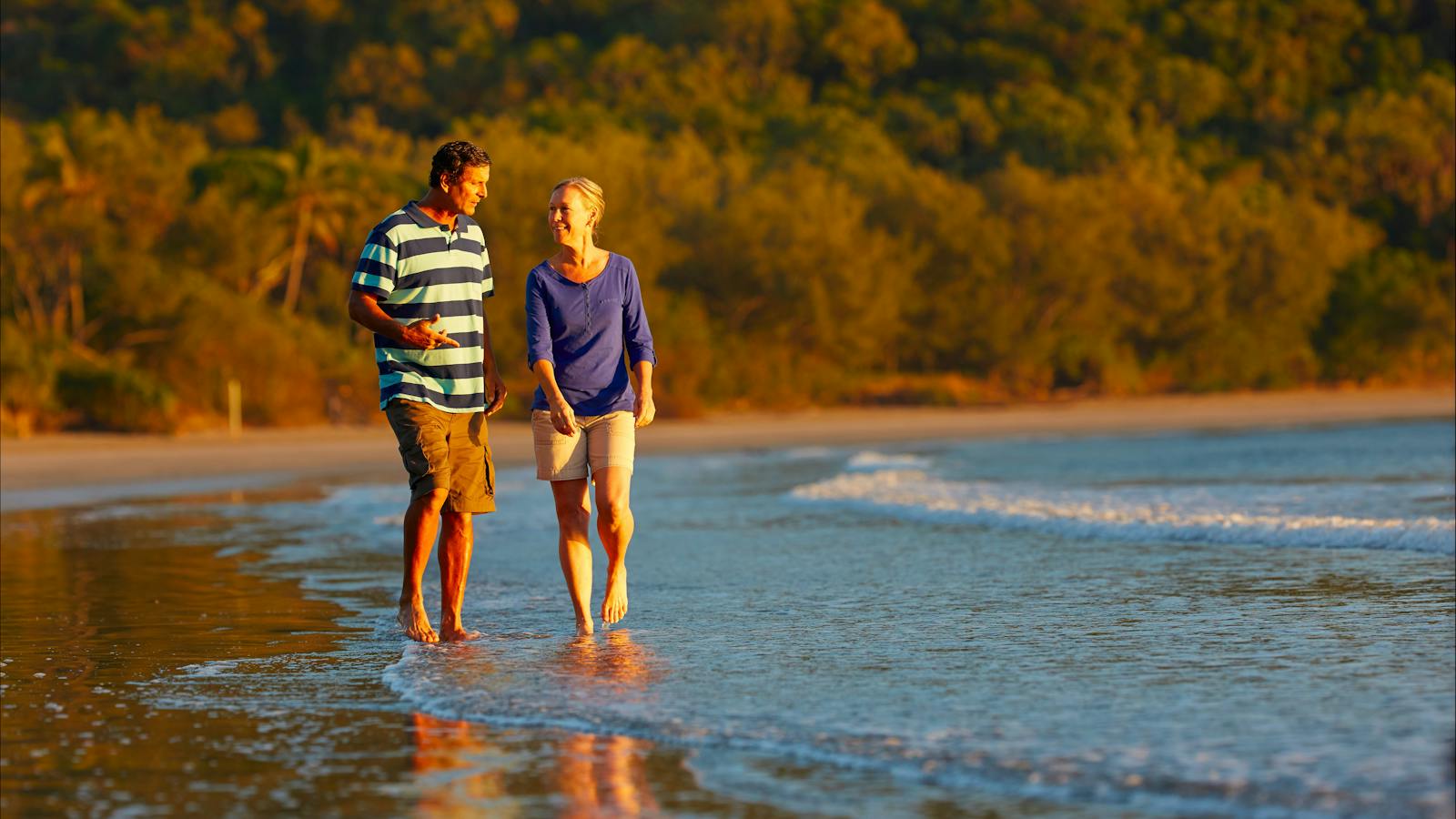 Couple taking a stroll along Cape Hillsborough beac