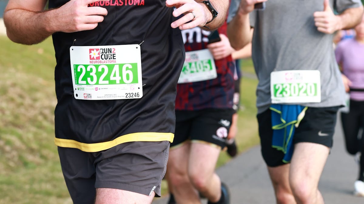 A runner with a Run2Cure singlet on.
