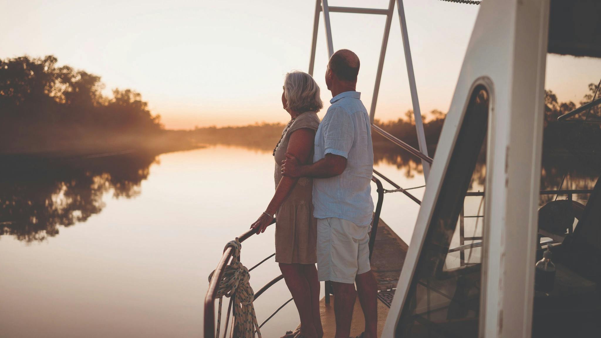 A couple watch the sunset on Outback Aussie Tours Catamaran on the Thomson River in Longreach. A couple watch the sunset on Outback Aussie Tours Catamaran on the Thomson River in Longreach.