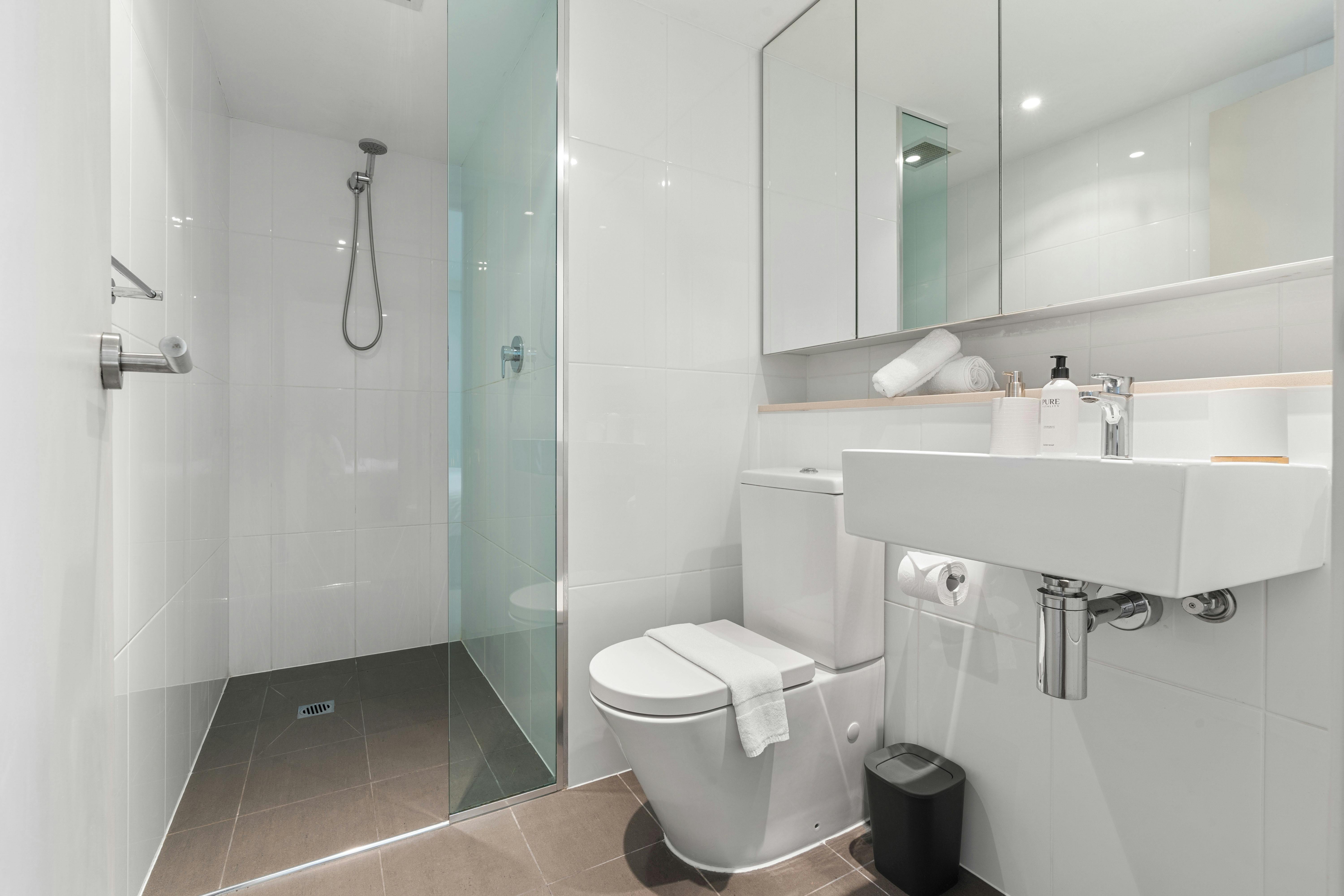Modern bathroom with sleek design and walk-in shower.