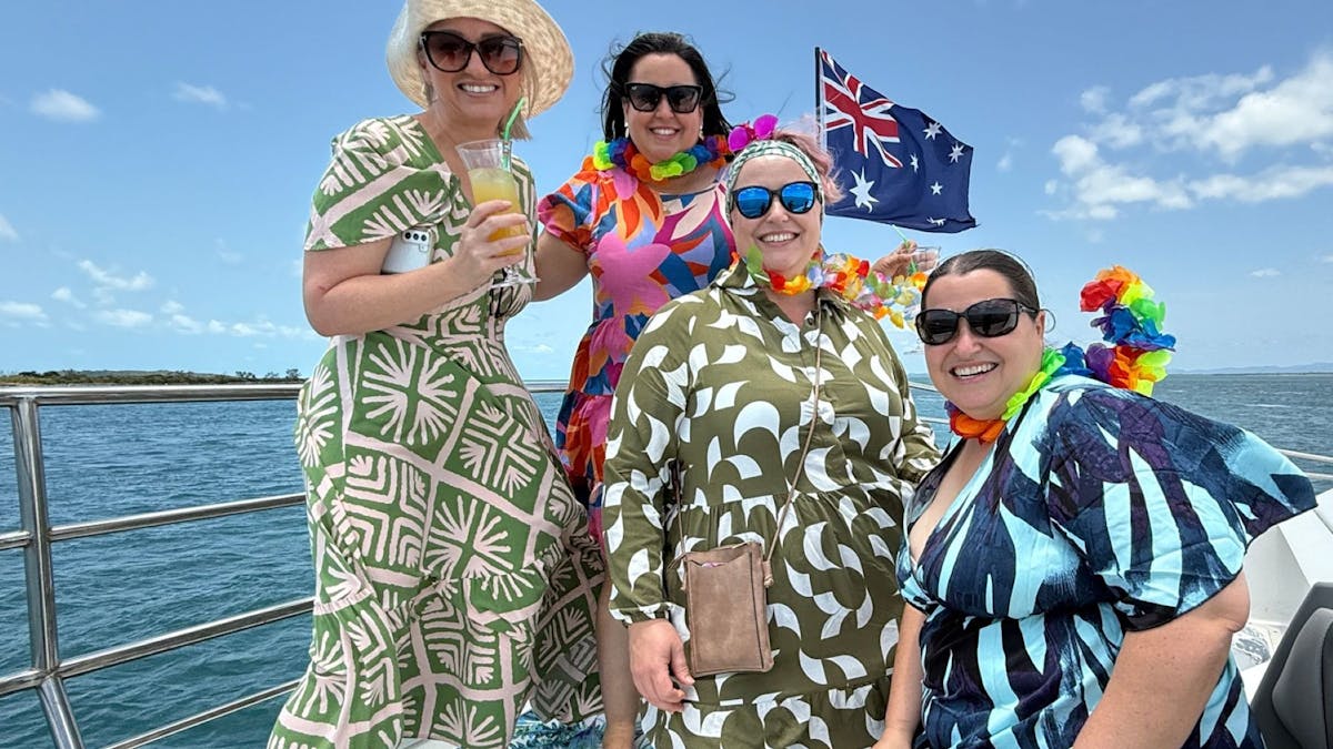 guests dressed in bright tropical colours on the front deck