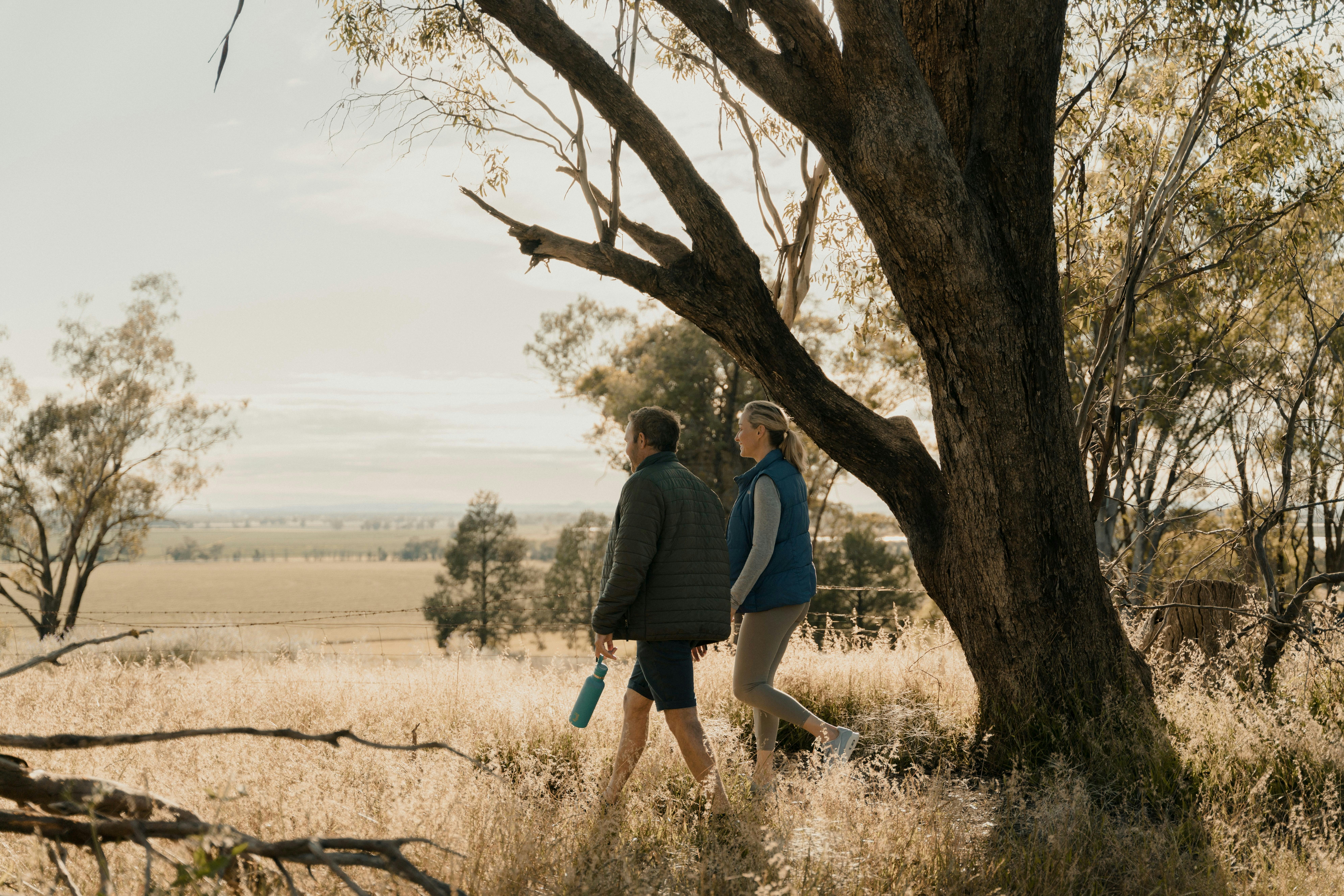 Couple enjoying the view of wide open spaces over farm land from Redlands Hills Reserve