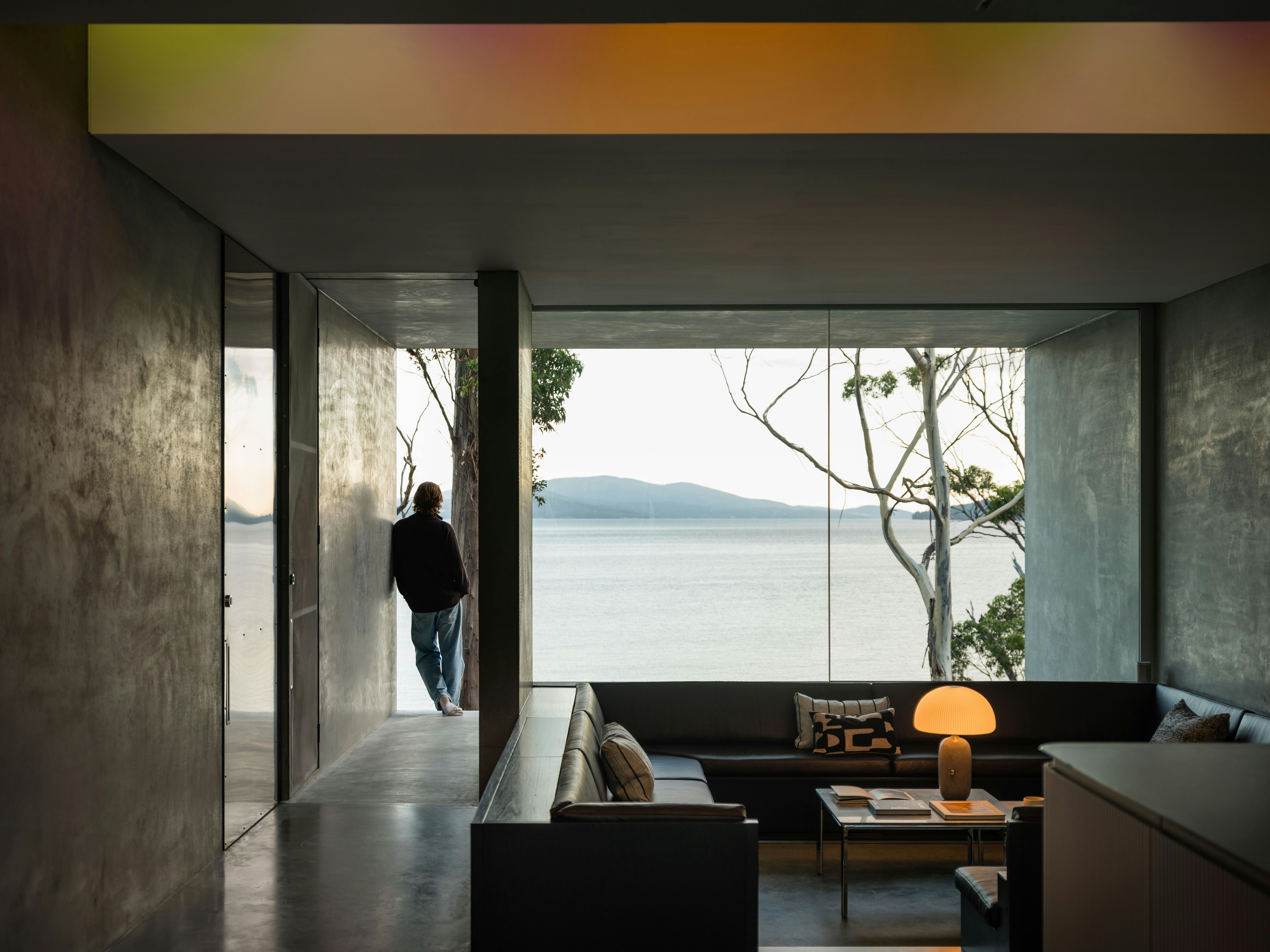 A man standing on the balcony looking at the view