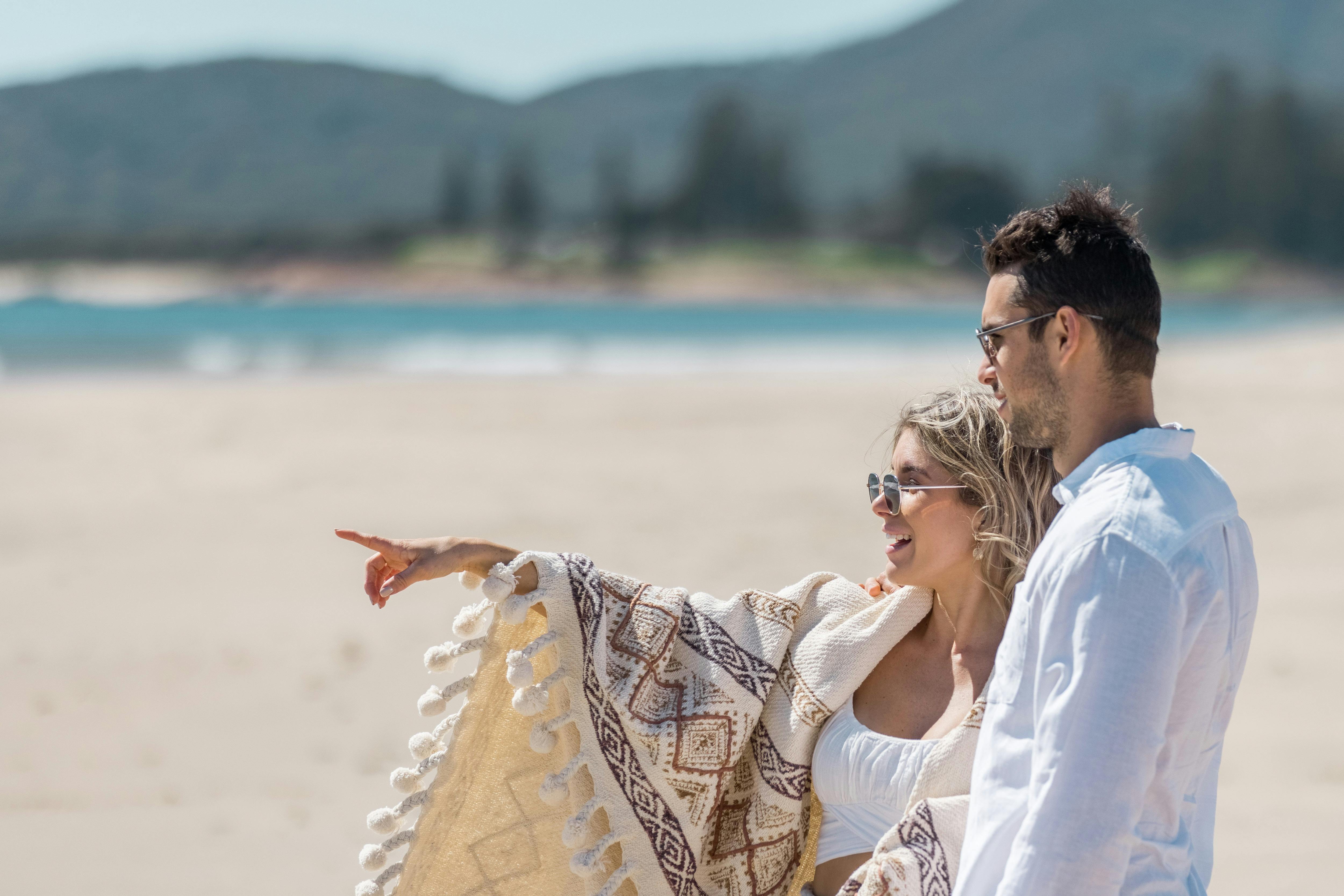 A couple enjoying the beach at South West Rocksying