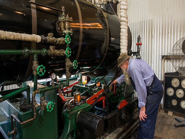 Photo of one of the volunteers running the steam engines
