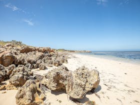Bright summers day with white sand and clear blue skies