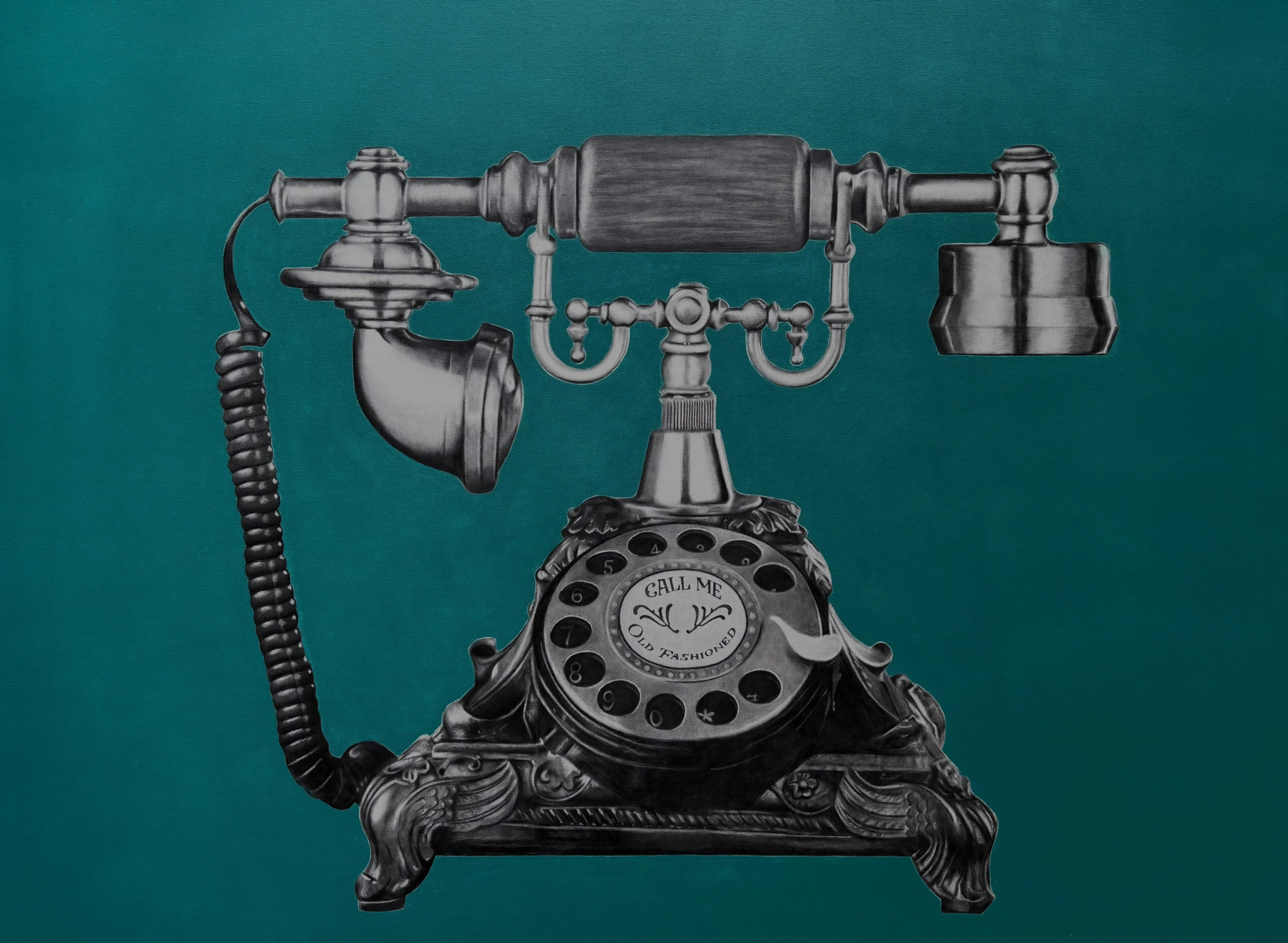 Cradle vintage telephone on teal background with quirky message