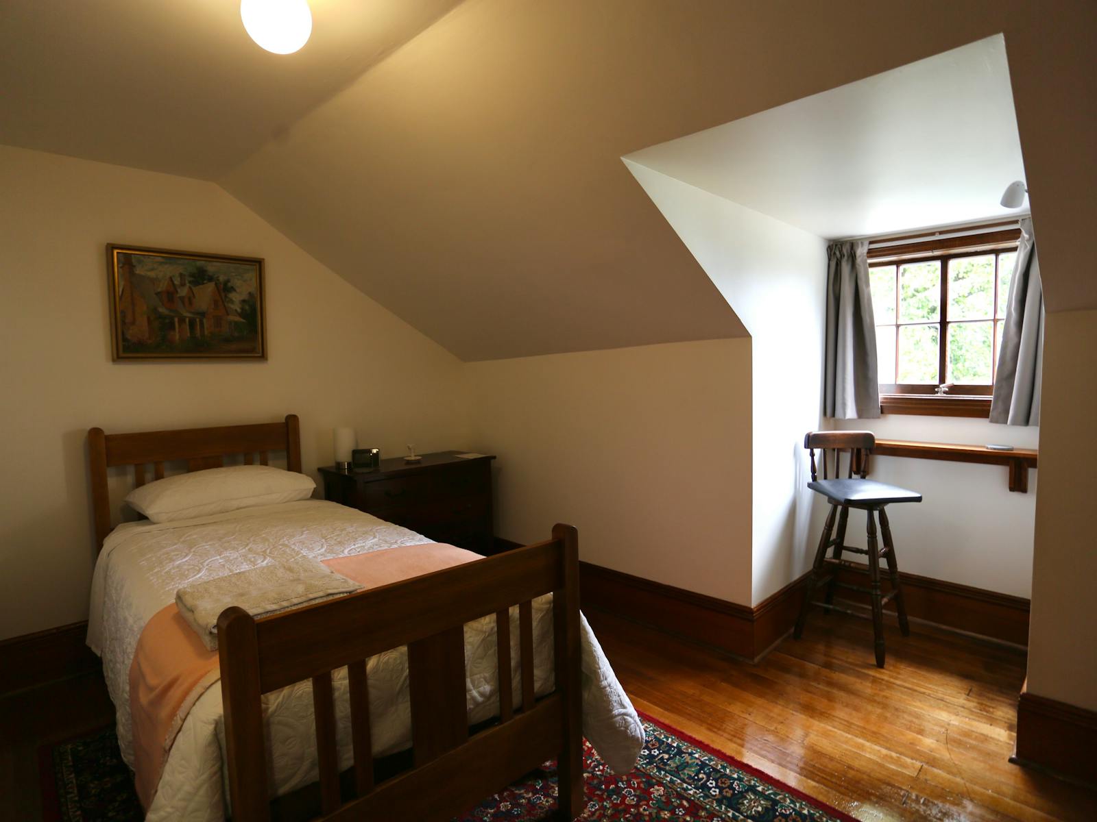 single bed in  bedroom with dormer window