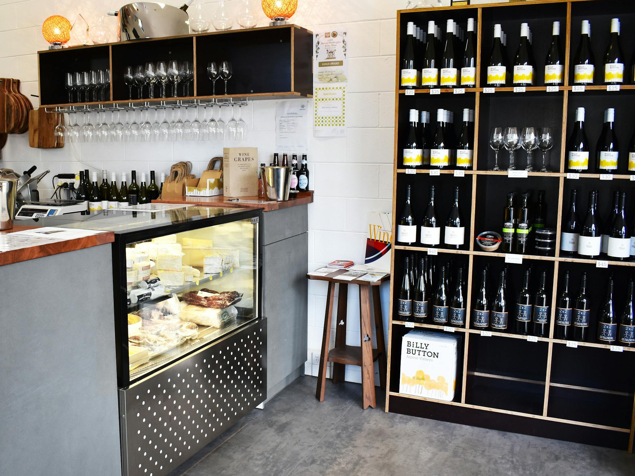 The front cheese counter and wine shelves inside Billy Button's Bright cellar door