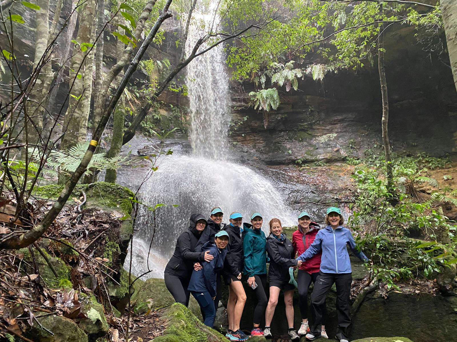 Freinds gathering beside a waterfall in Fitzroy Falls NP