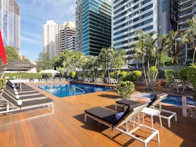 Royal on the Park Hotel outdoor pool with sunlounges, sun deck and heated hot spa