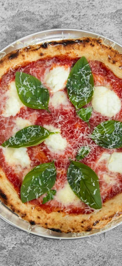 San Marzano Tomatoes, Fior de latte, Basil, oregano finish with grated Parmesan cheese