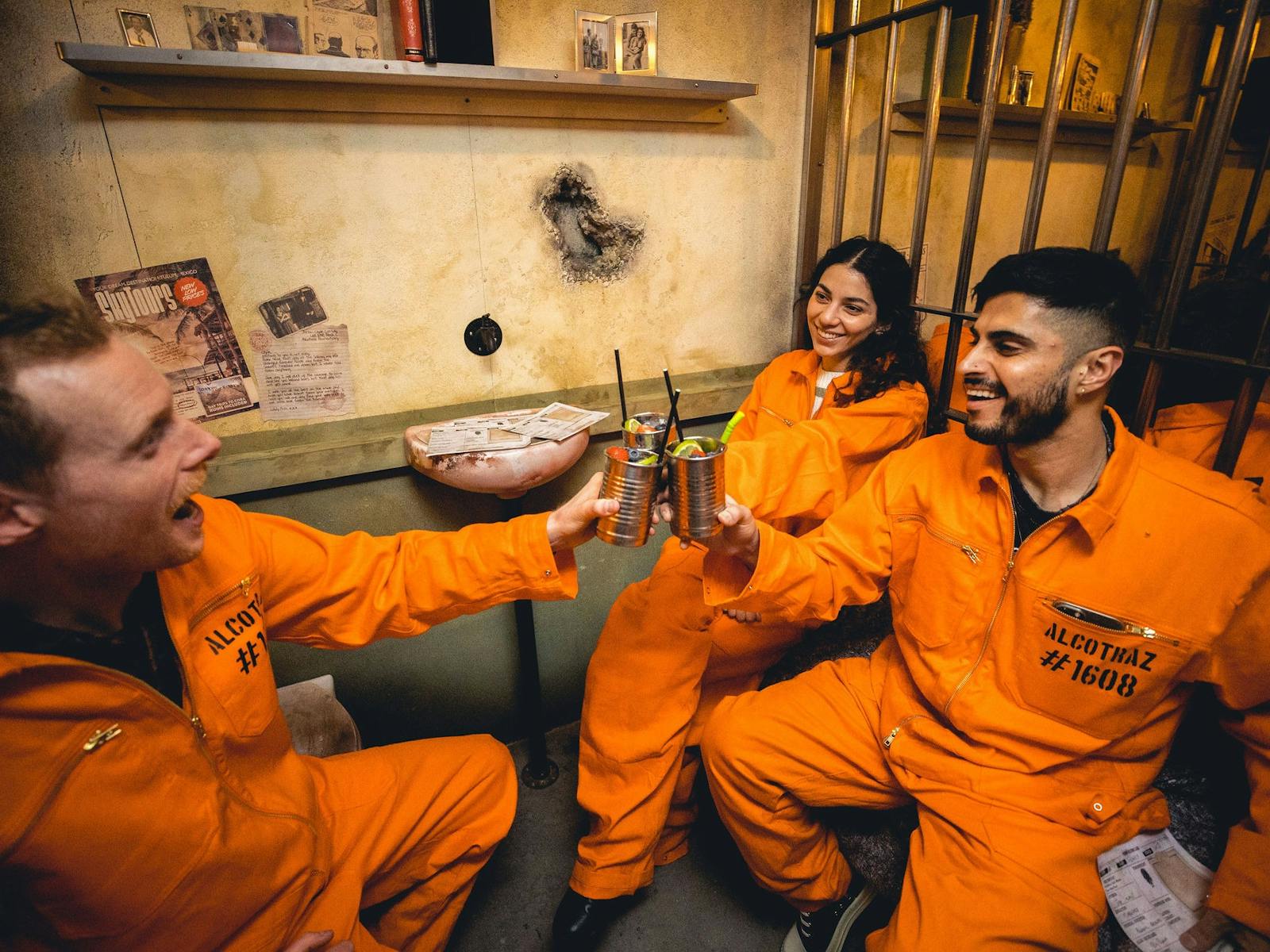 Friends cheers a drink within a theatrical space Friends cheers a drink within a theatrical space