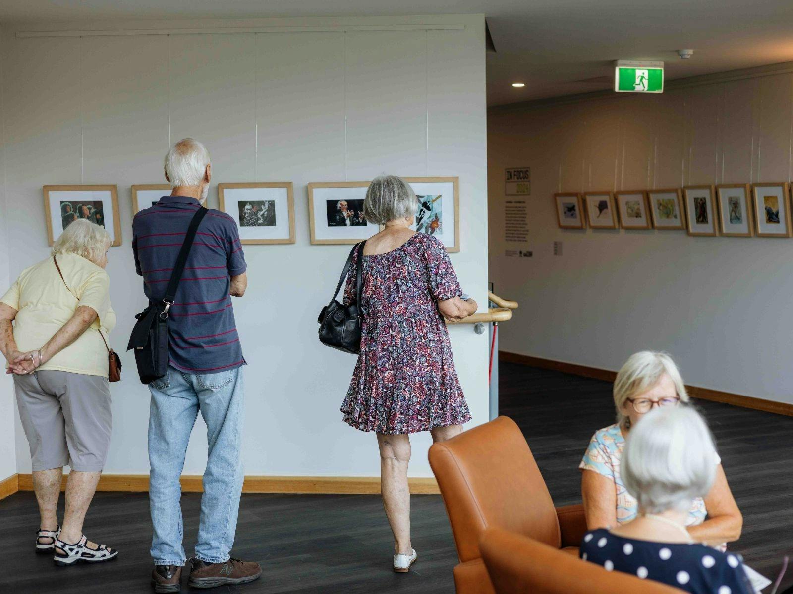 People looking at artwork