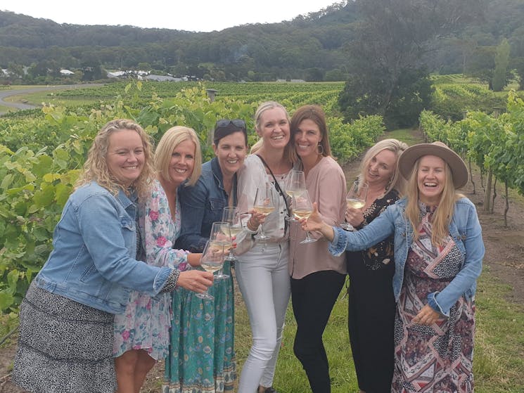 group laughing in vineyards