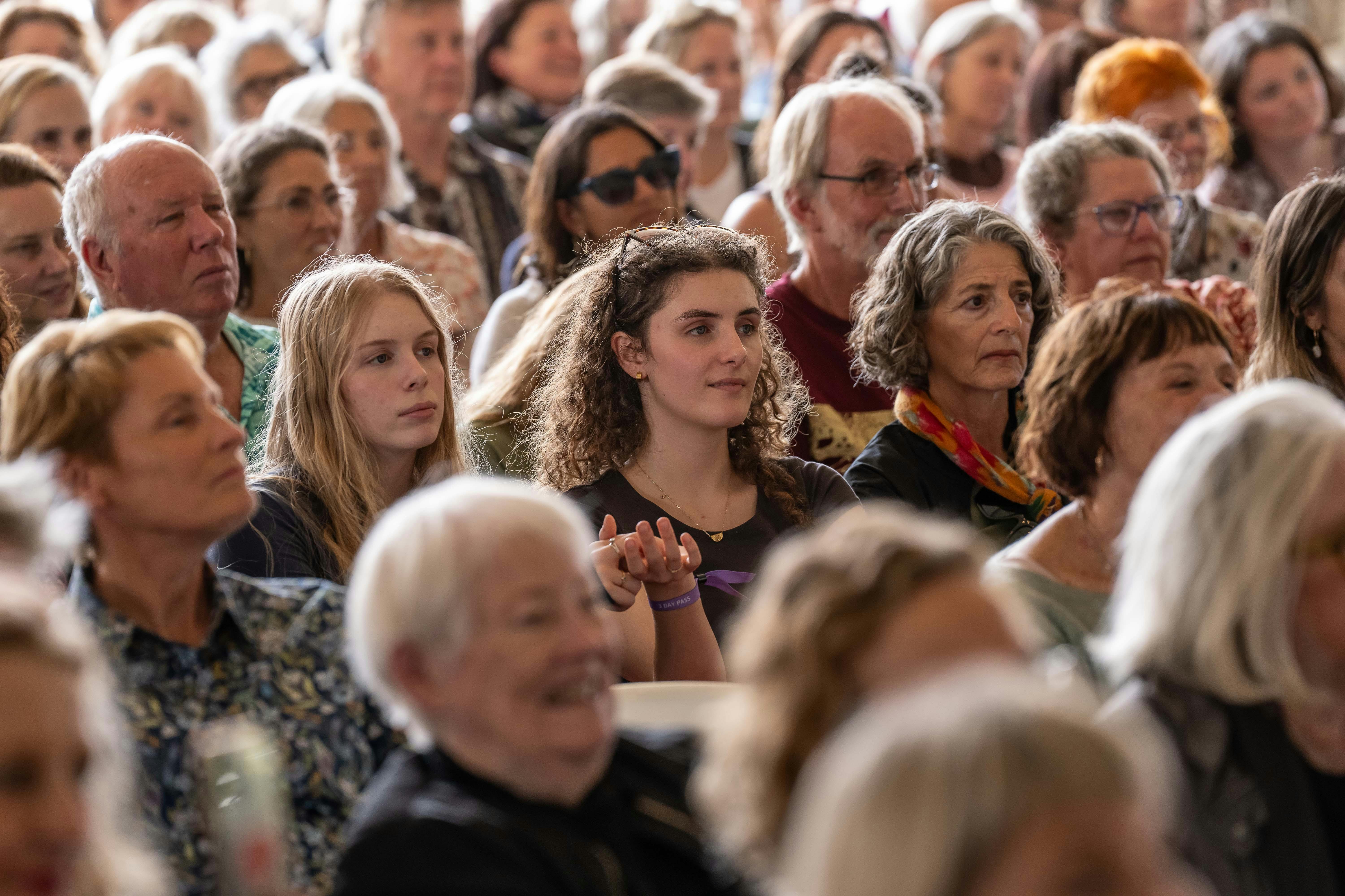 The crowd enjoying Byron Writers Festival in a festival marquee