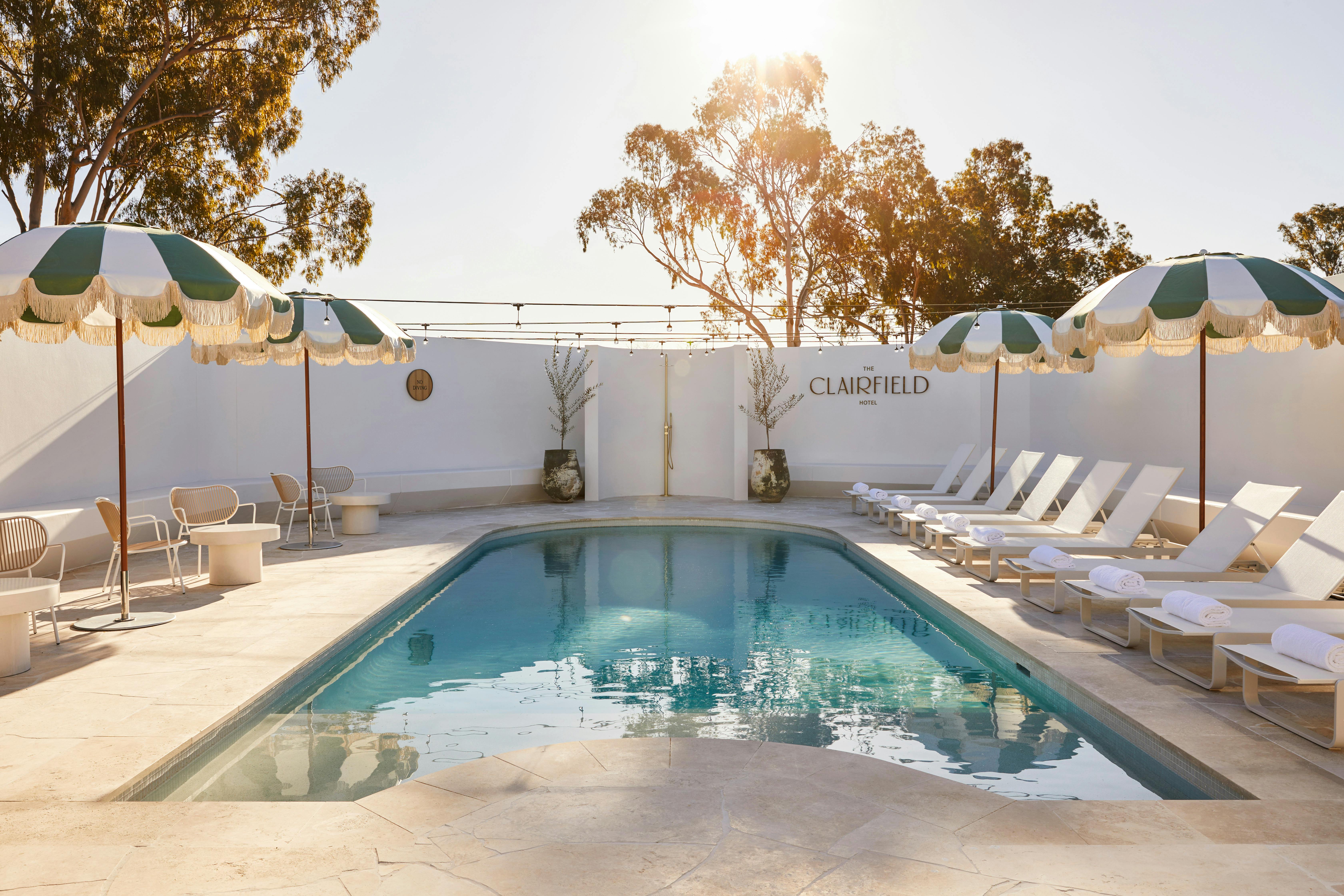 Enclosed hotel pool with daybeds