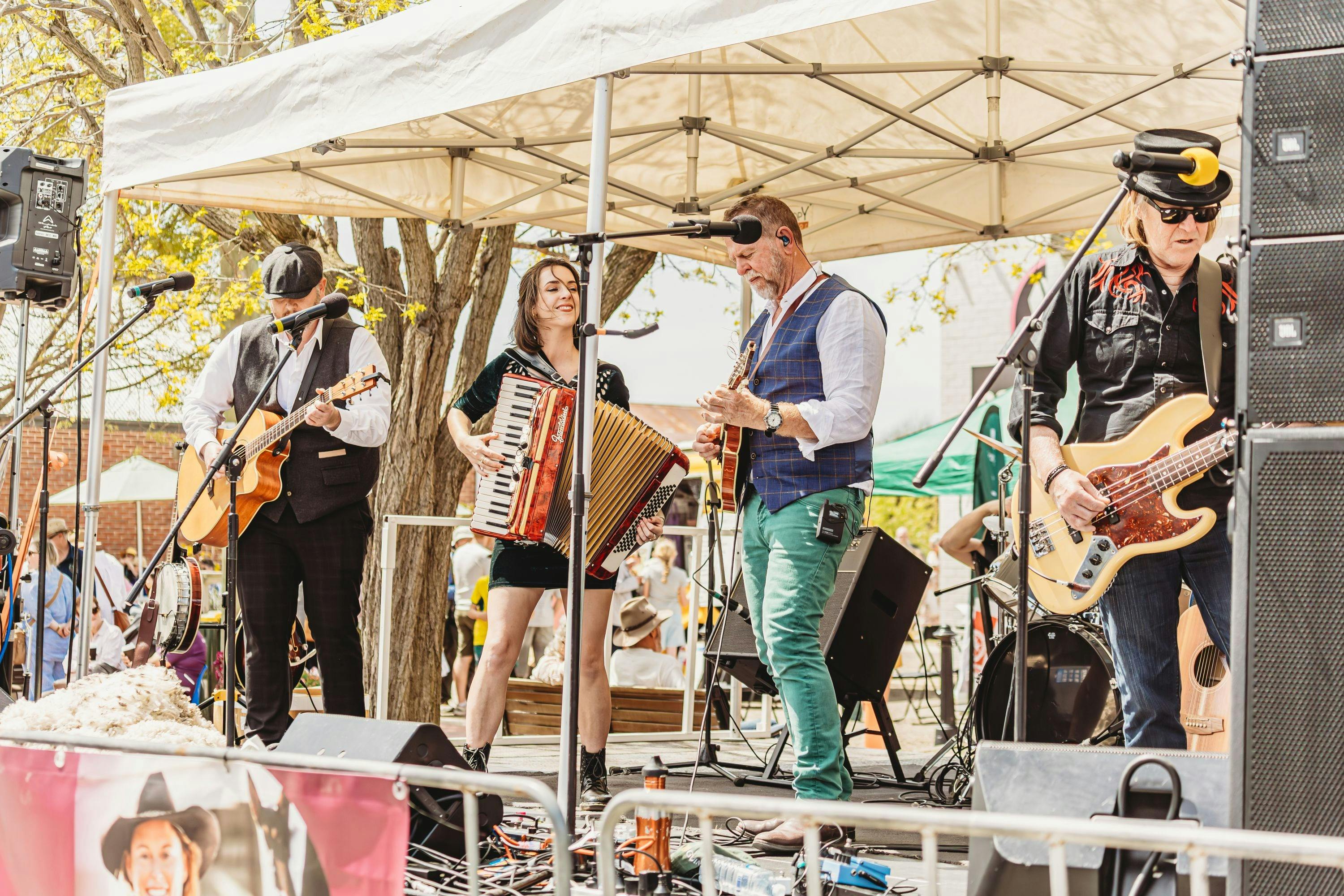 Double Shot Maggie band performing on the main stage.