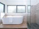 Northern Exposure Bright bathroom featuring shower and bathtub