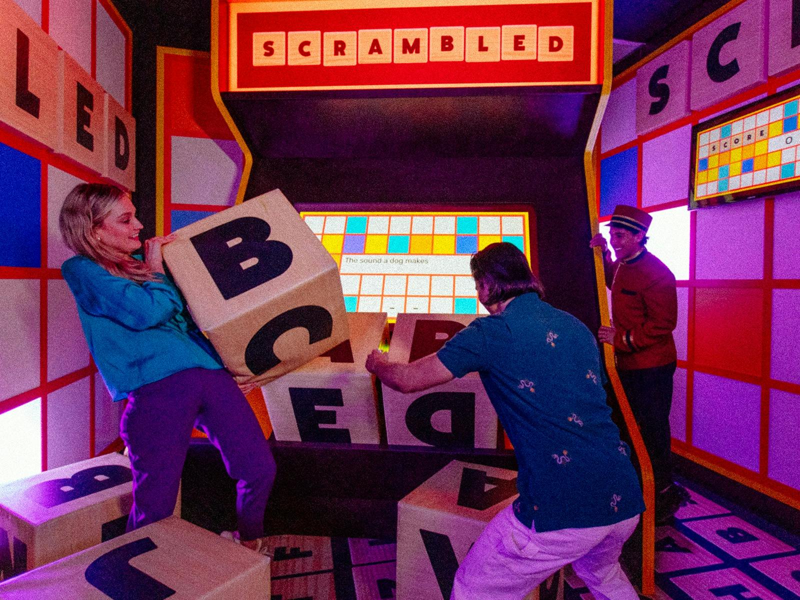 People playing Giant Scrabble People playing Giant Scrabble