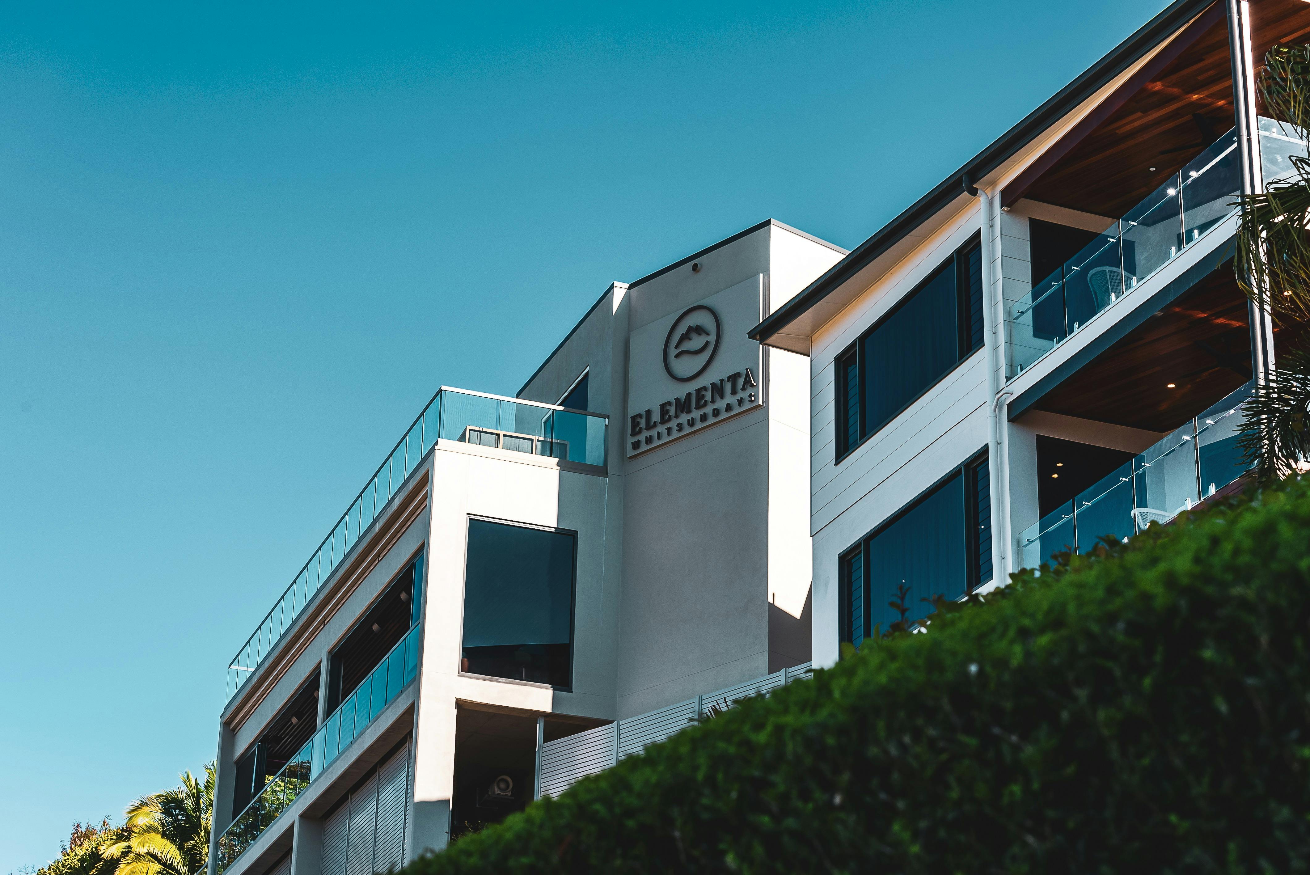 The Elementa Whitsundays events venue, with rooftop bar against clear blue skies at golden hour
