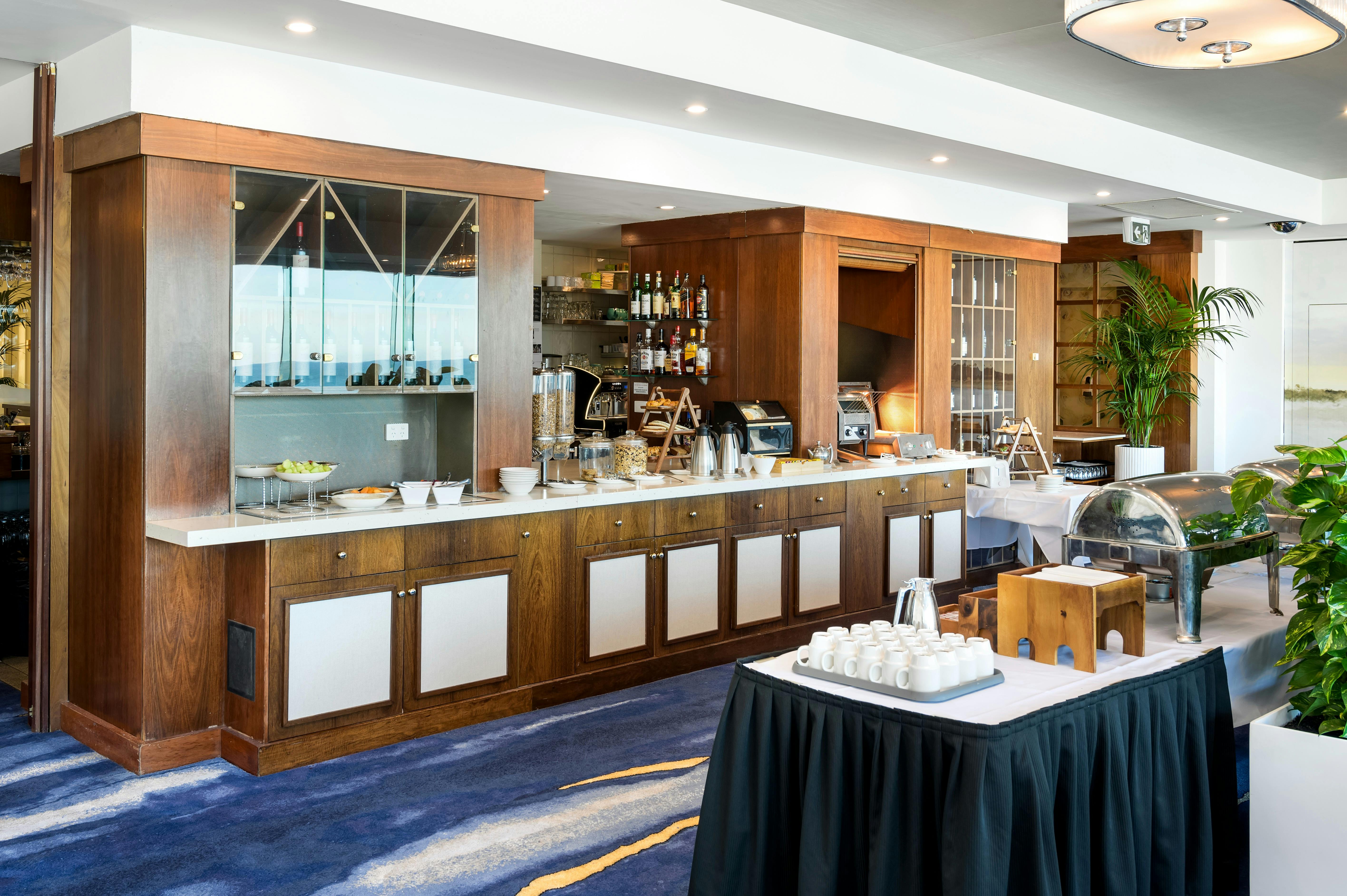 Buffet Breakfast setup with cereal, yogurt, fruit, toast and hot food setup