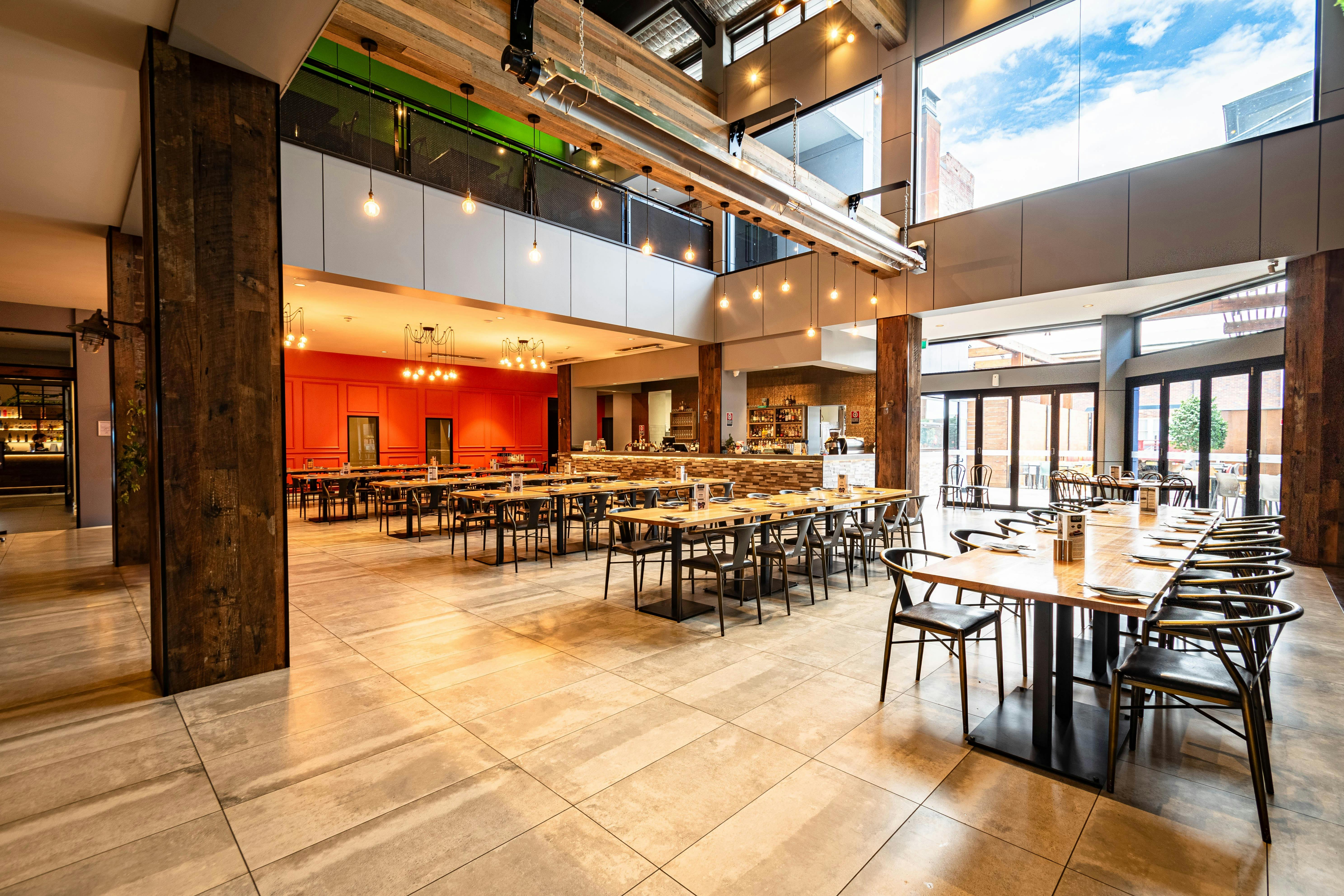 Interior image of the Bistro at The Broken Hill Pub. Looking at the main bar and outdoor beer garden