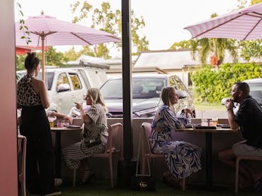 Two couples dining at Code Cairns Holloways Beach