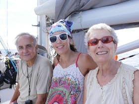 three guests on Ocean Free sailing to Green Island and Great Barrier Reef, sail , snorkel
