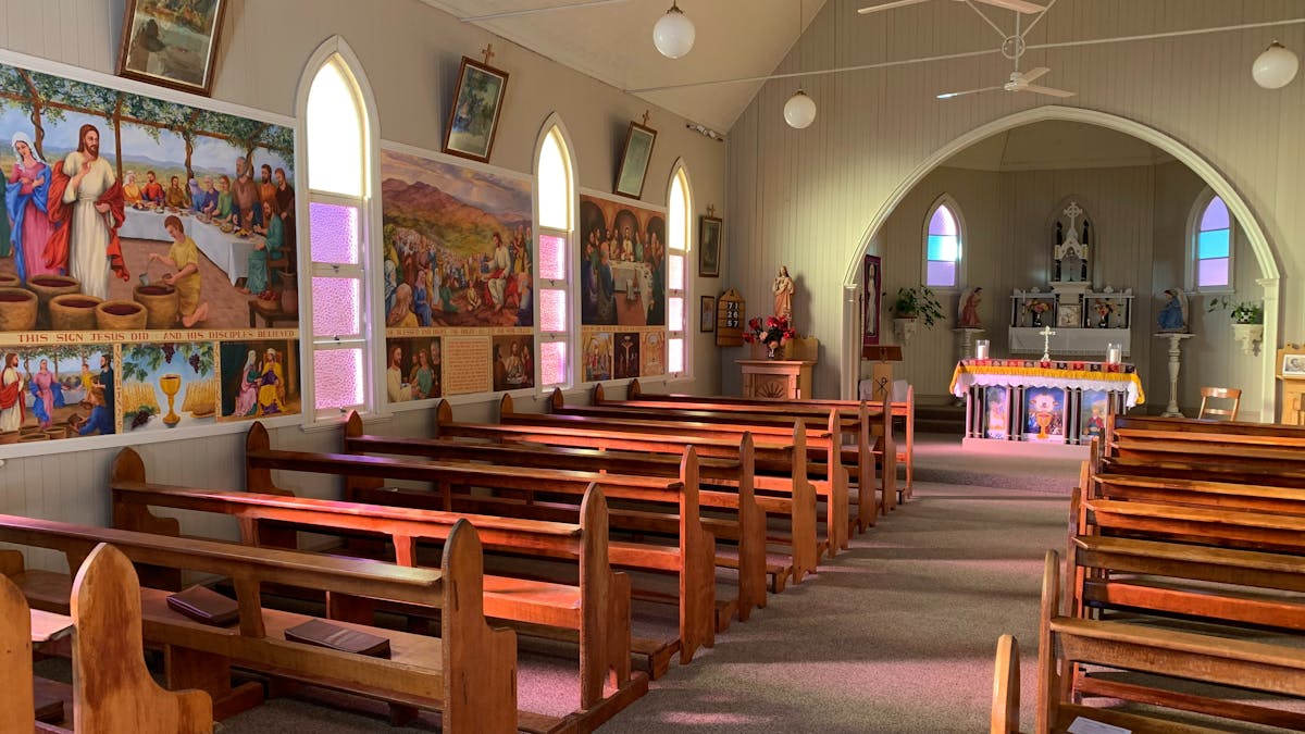 Interior of church with beautiful stained glass windows.