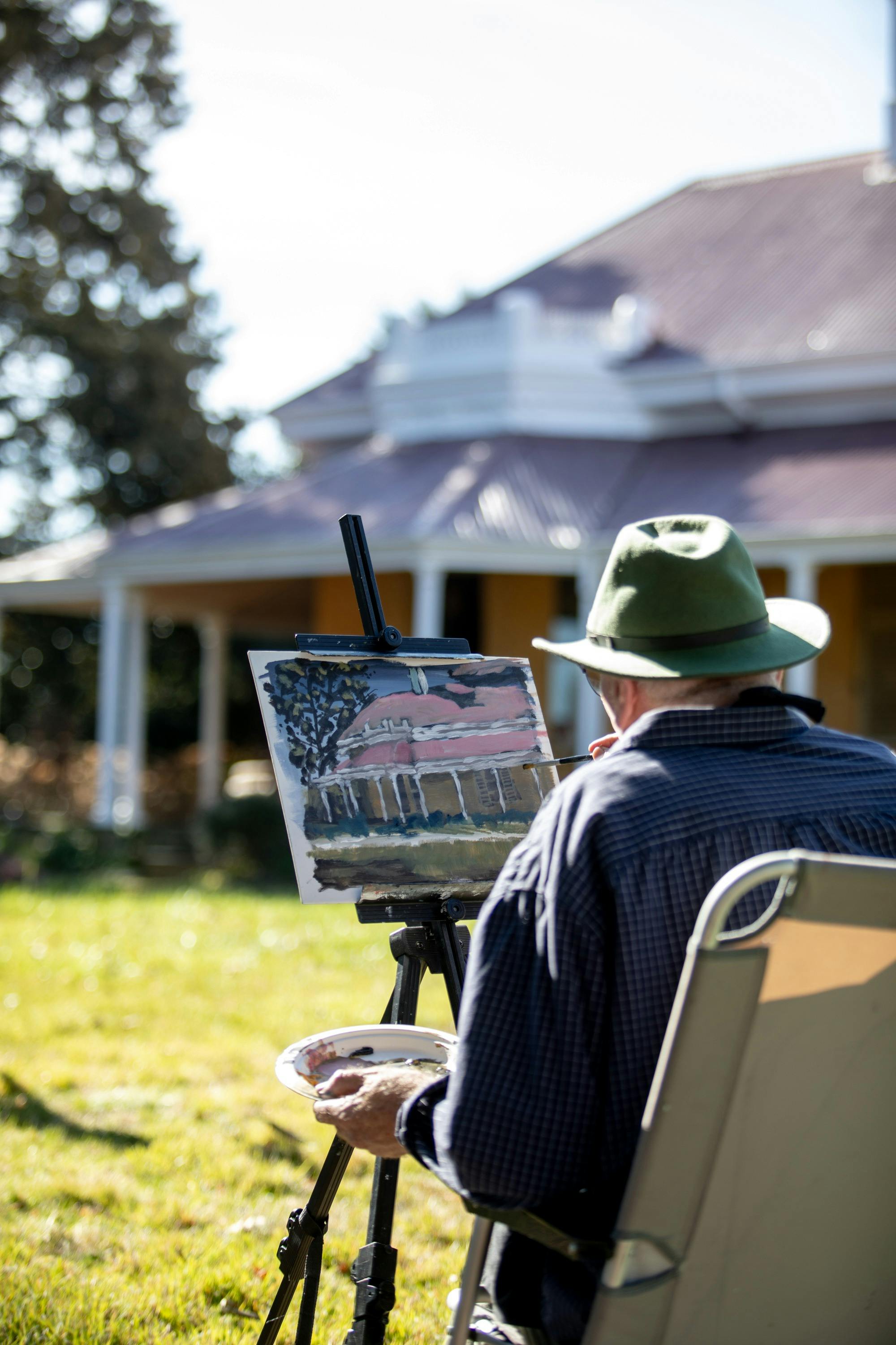 Artist working on plein air painting