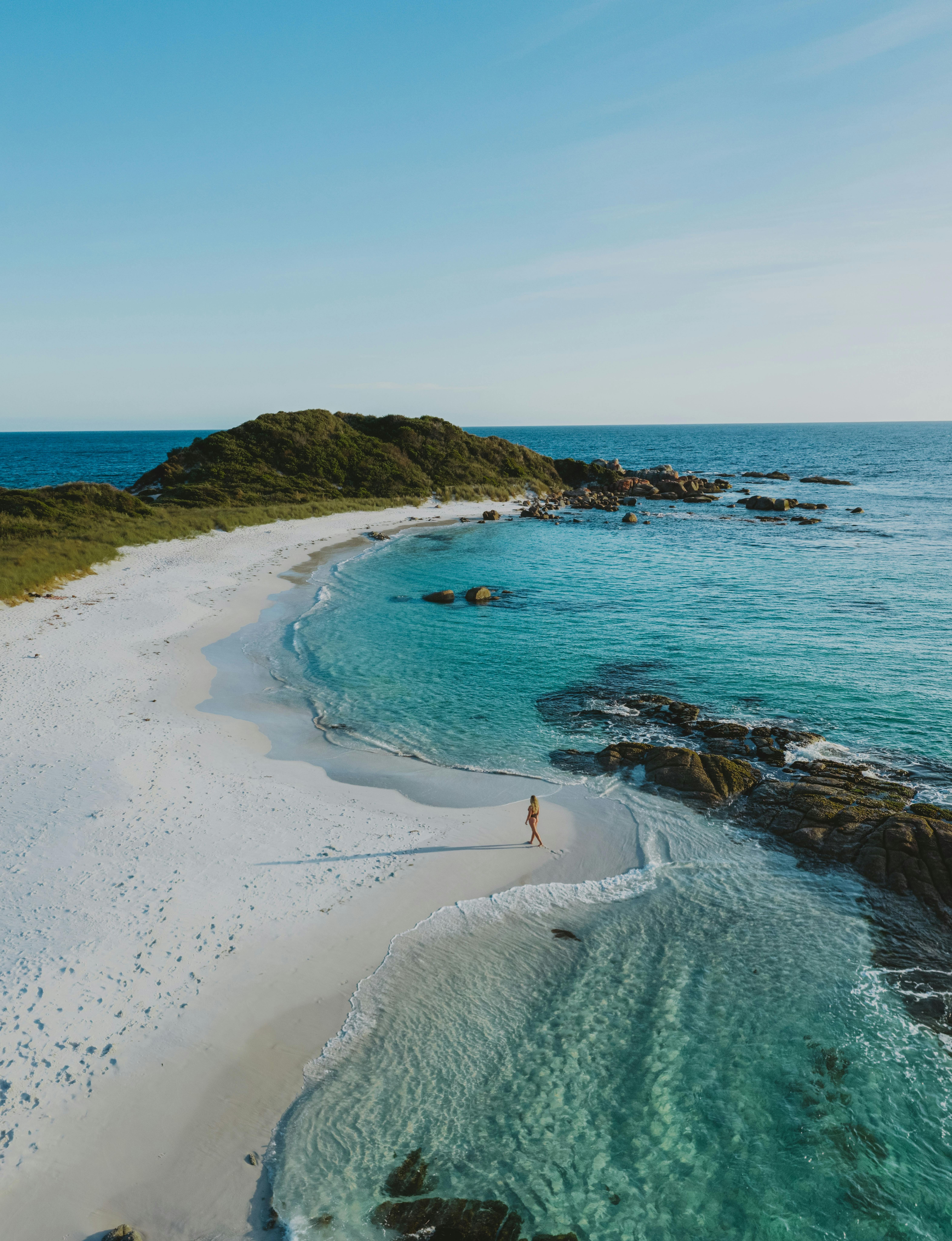 Aerial of white sand beach and turquoise water near Binalong Bay Tasmania
