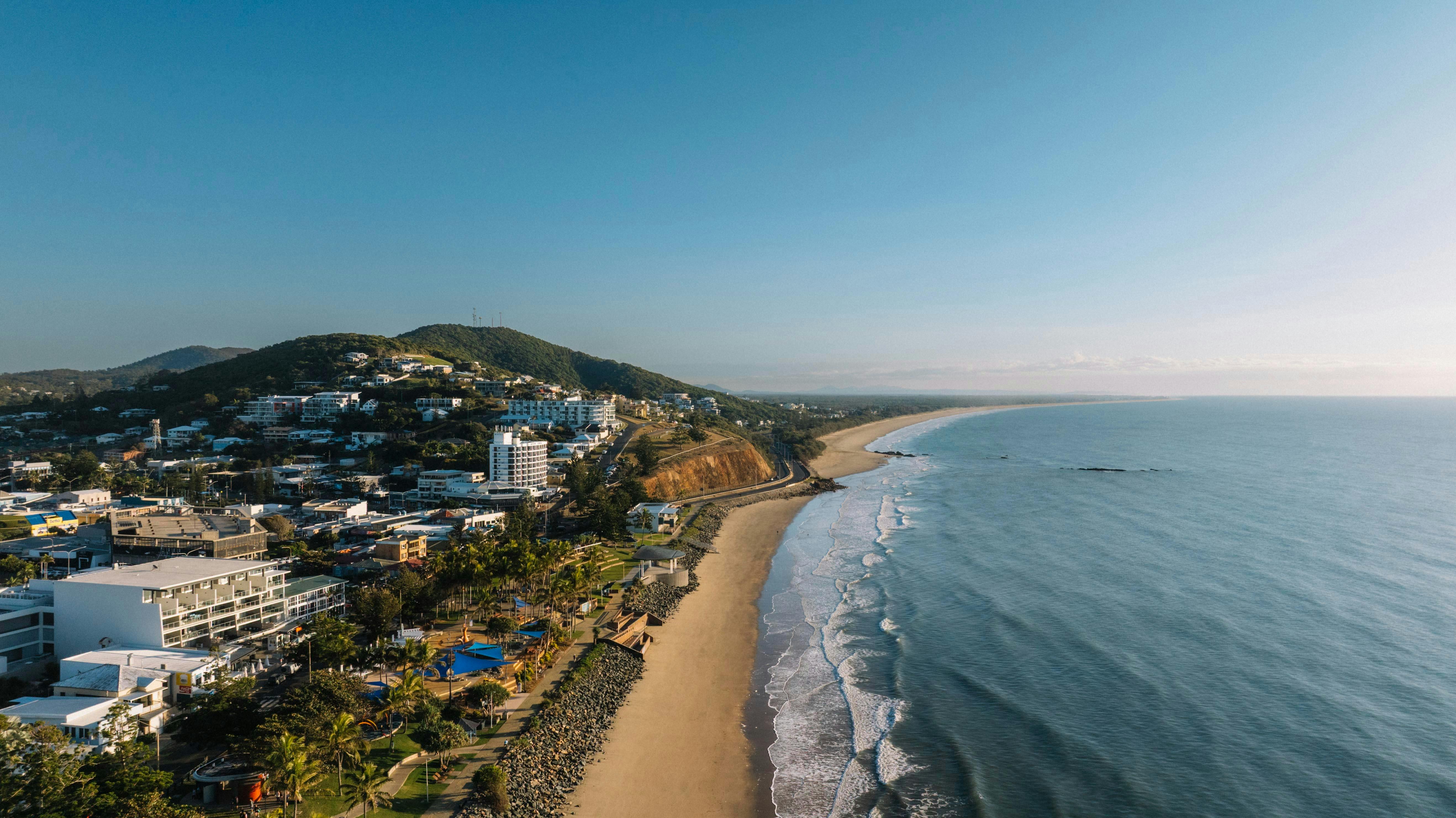 Aerial view of the Yeppoon Running Festival event precinct, with participants gathered beside the be