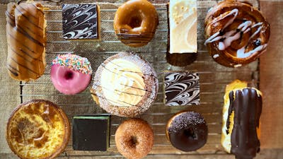 trapper donuts with chocolate eclairs and apple pies