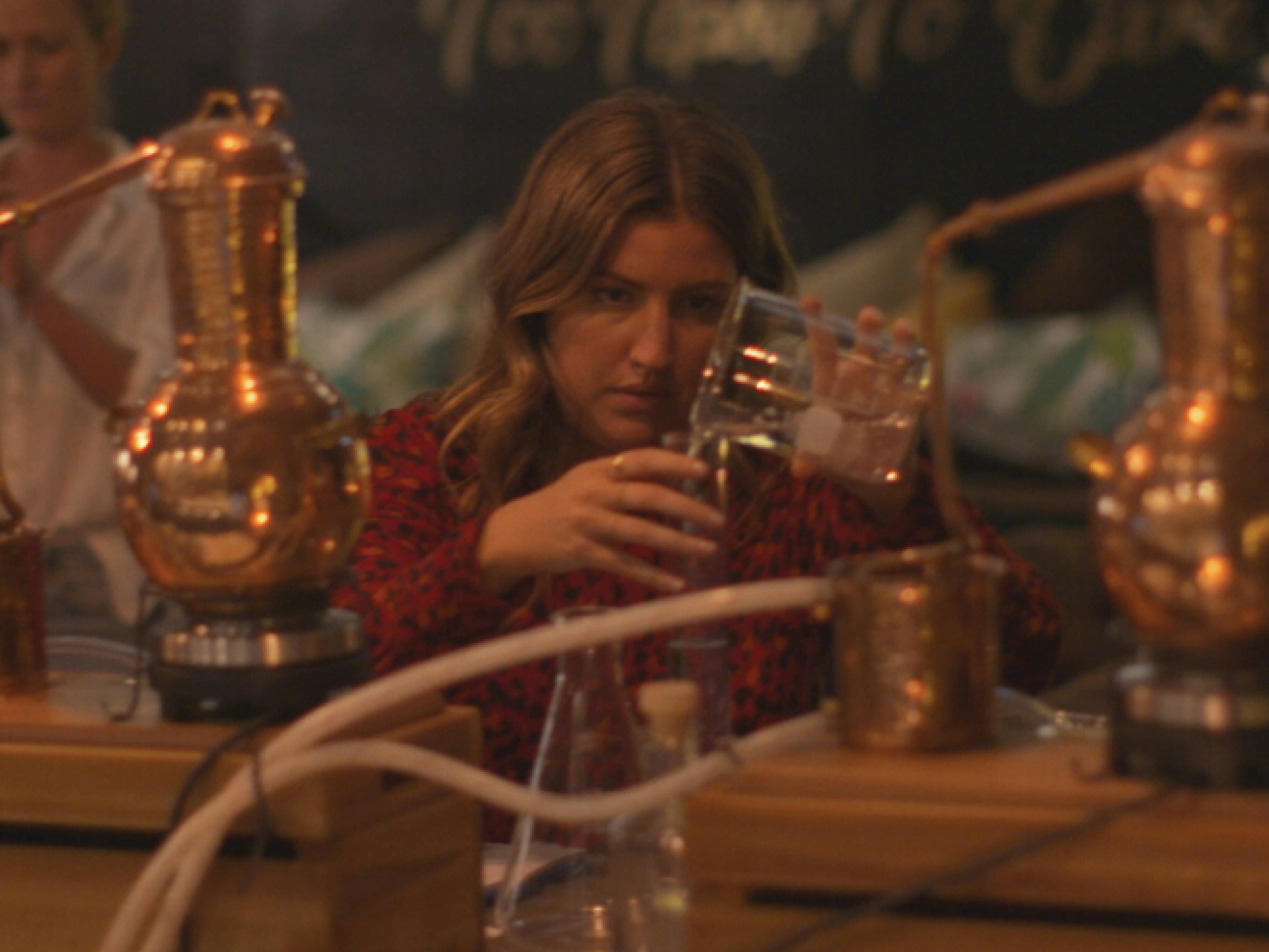 A guest using the 2L copper still