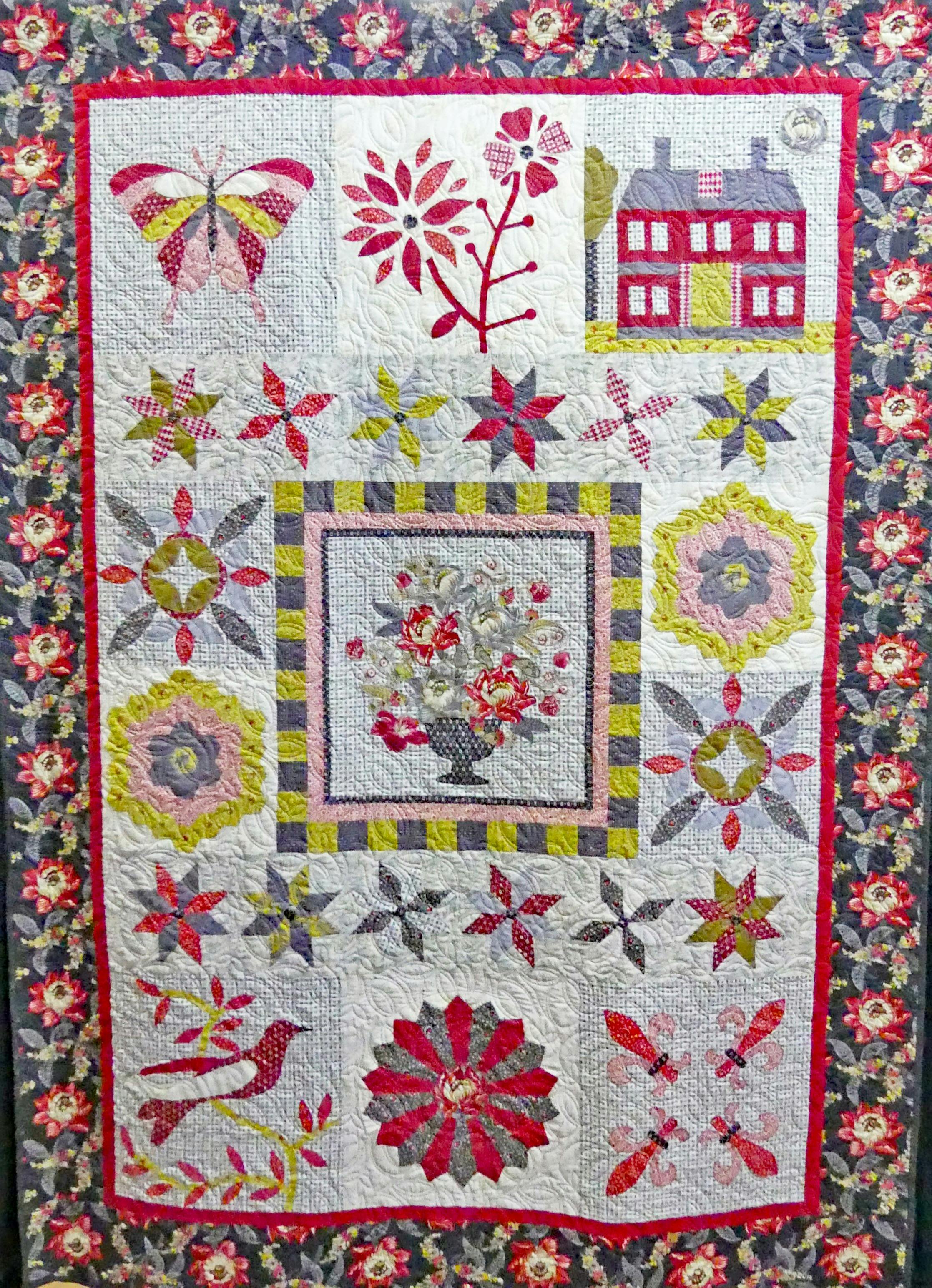 Quilt in pinks and golds.