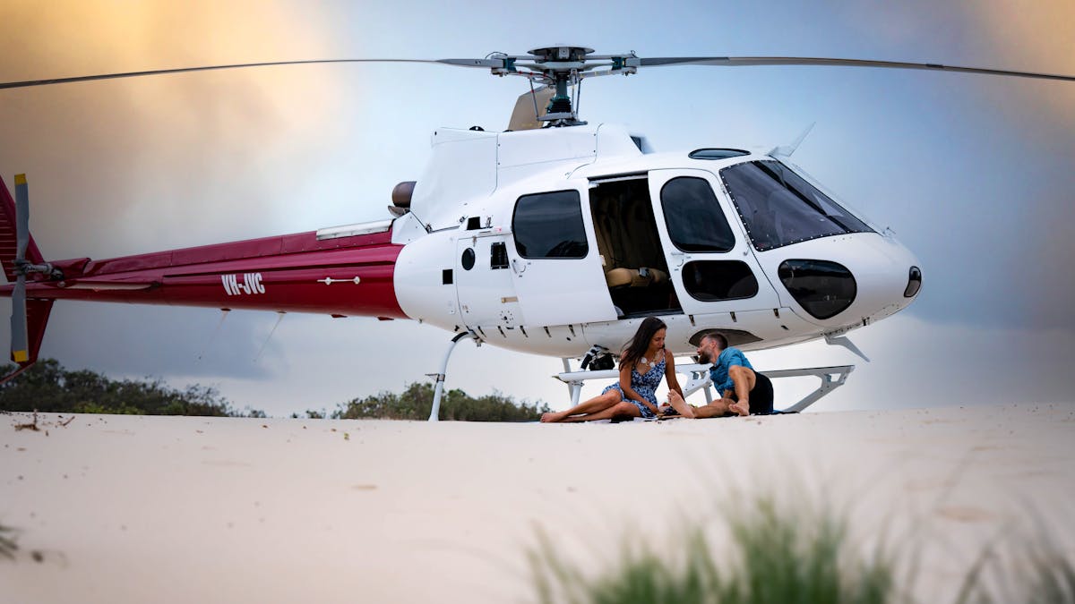 Private beach picnic with the Airbus H125 helicopter in the background