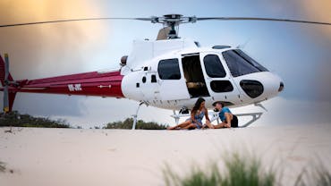 Private beach picnic with the Airbus H125 helicopter in the background